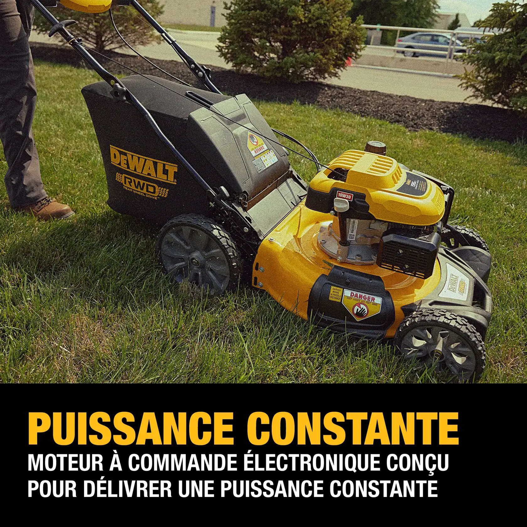 A DEWALT-branded yellow and black lawn mower with a rear wheel drive feature is shown on grass, accompanied by promotional text highlighting its electronically governed engine designed for consistent power.
