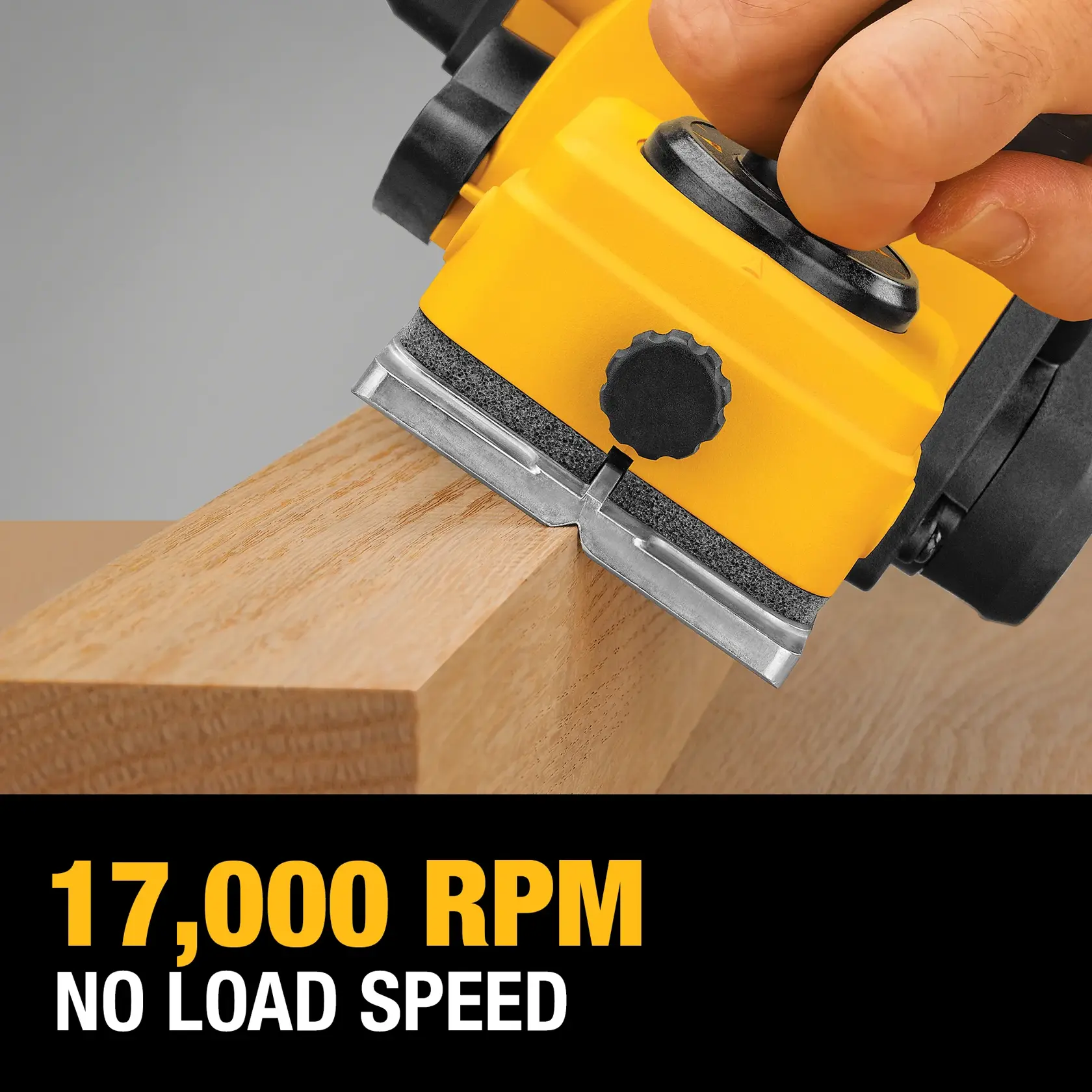 A close-up of a yellow DEWALT power tool being used to plane the edge of a wooden plank, with a hand operating the tool. The text on the image reads '17,000 RPM NO LOAD SPEED.'