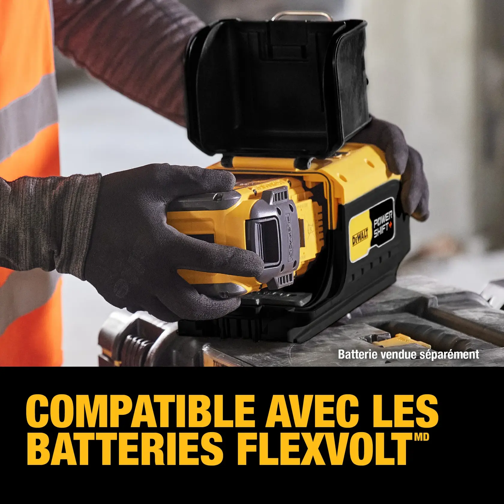 A person wearing gloves inserts a DEWALT FLEXVOLT battery into a DEWALT Power Shift device, with the text 'COMPATIBLE WITH FLEXVOLT BATTERIES' in bold yellow letters at the bottom. The image also notes that the battery is sold separately.