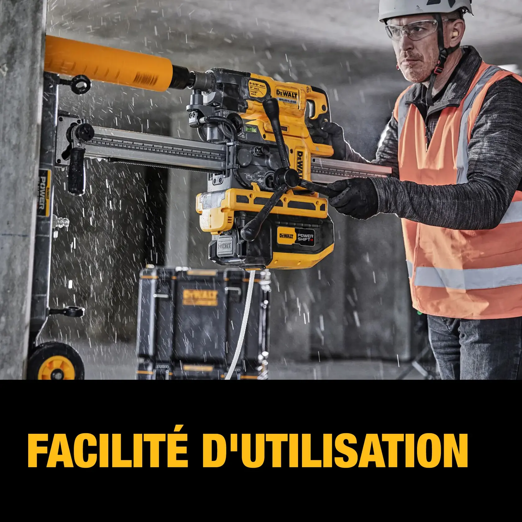 A construction worker wearing a safety vest and helmet uses a DEWALT power tool to drill into a concrete pillar. Water is spraying as the tool operates, and a DEWALT equipment case can be seen in the background. The text 'EASE OF USE' is displayed at the bottom.