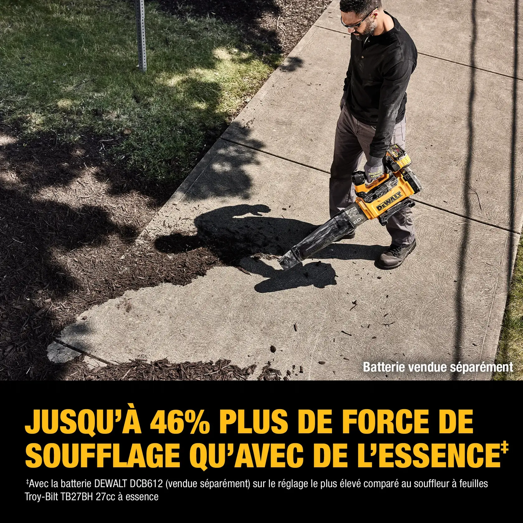 A person is using a DEWALT DCBL777B cordless leaf blower to clear debris from a sidewalk near grass and mulch, with a note indicating that the battery is sold separately. Bold yellow text reads 'UP TO 46% MORE BLOWING FORCE THAN GAS,' and smaller text explains this is using a specific DEWALT battery on turbo speed compared to a gas leaf blower.