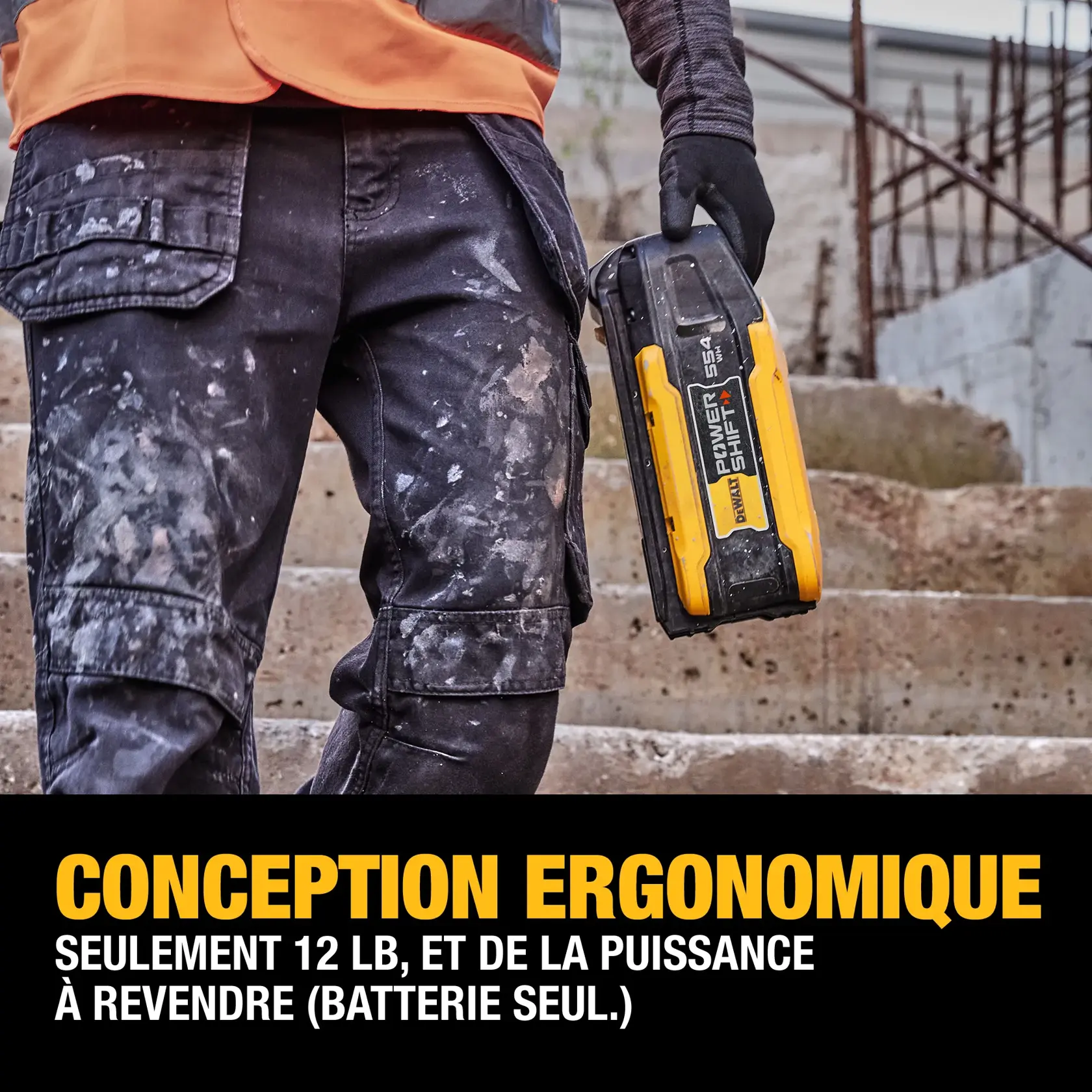 A person wearing work gloves and paint-stained pants is holding a DEWALT PowerShift 554 battery. They are standing on concrete steps, and text below highlights the battery's ergonomic design and high capacity to weight ratio at 12 lbs (battery only).