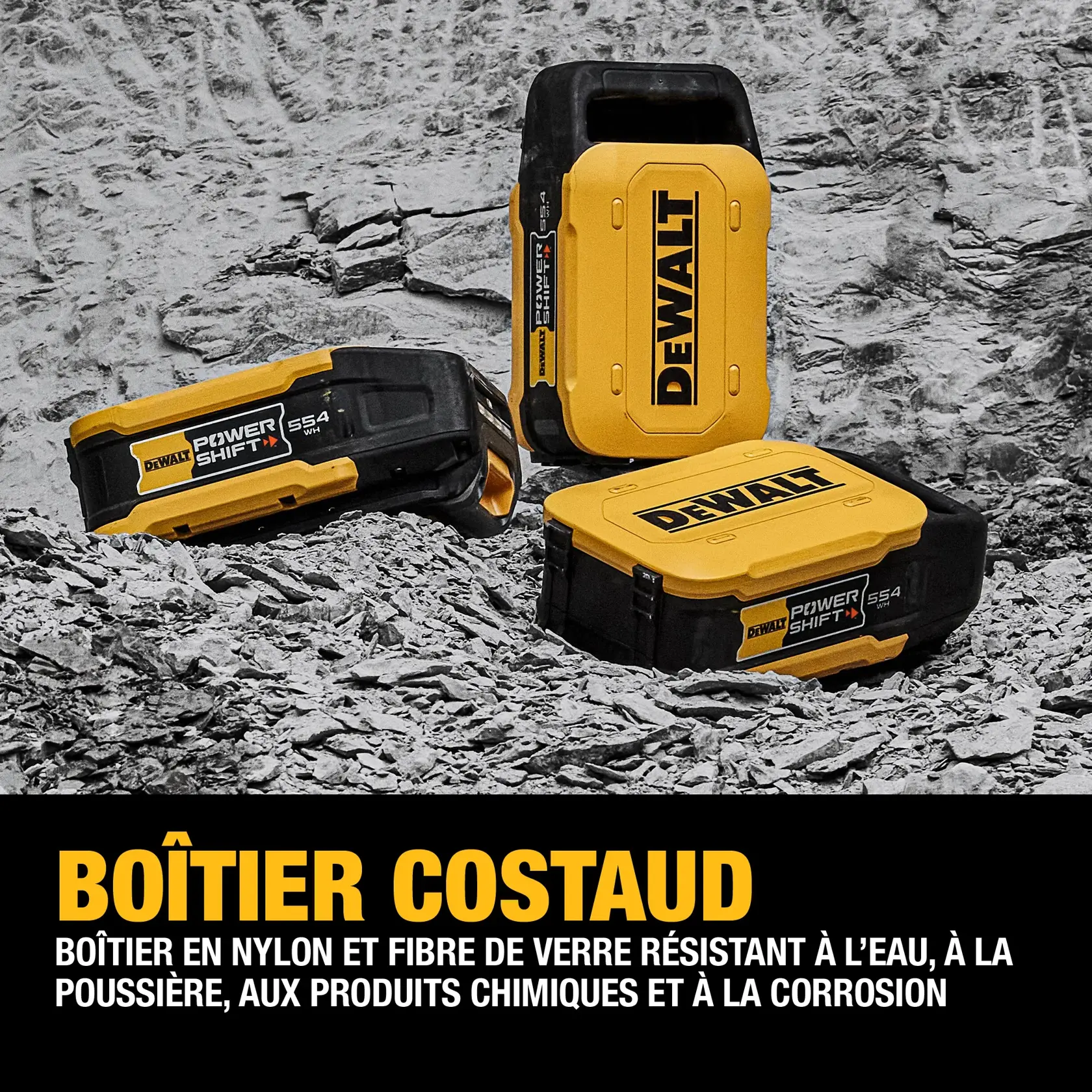 Three DEWALT Power Shift SS4 battery packs with durable glass-filled nylon housing are displayed on a rocky surface. The packs are designed to resist water, dust, chemicals, and corrosion.