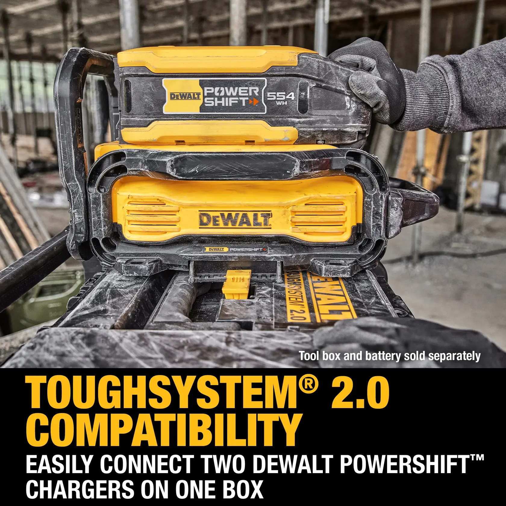 A DEWALT ToughSystem 2.0 box with two DEWALT PowerShift chargers connected on top, shown at a construction site with a gloved hand placing a charger. Text reads: 'ToughSystem 2.0 Compatibility. Easily connect two DEWALT PowerShift chargers on one box. Tool box and battery sold separately.'