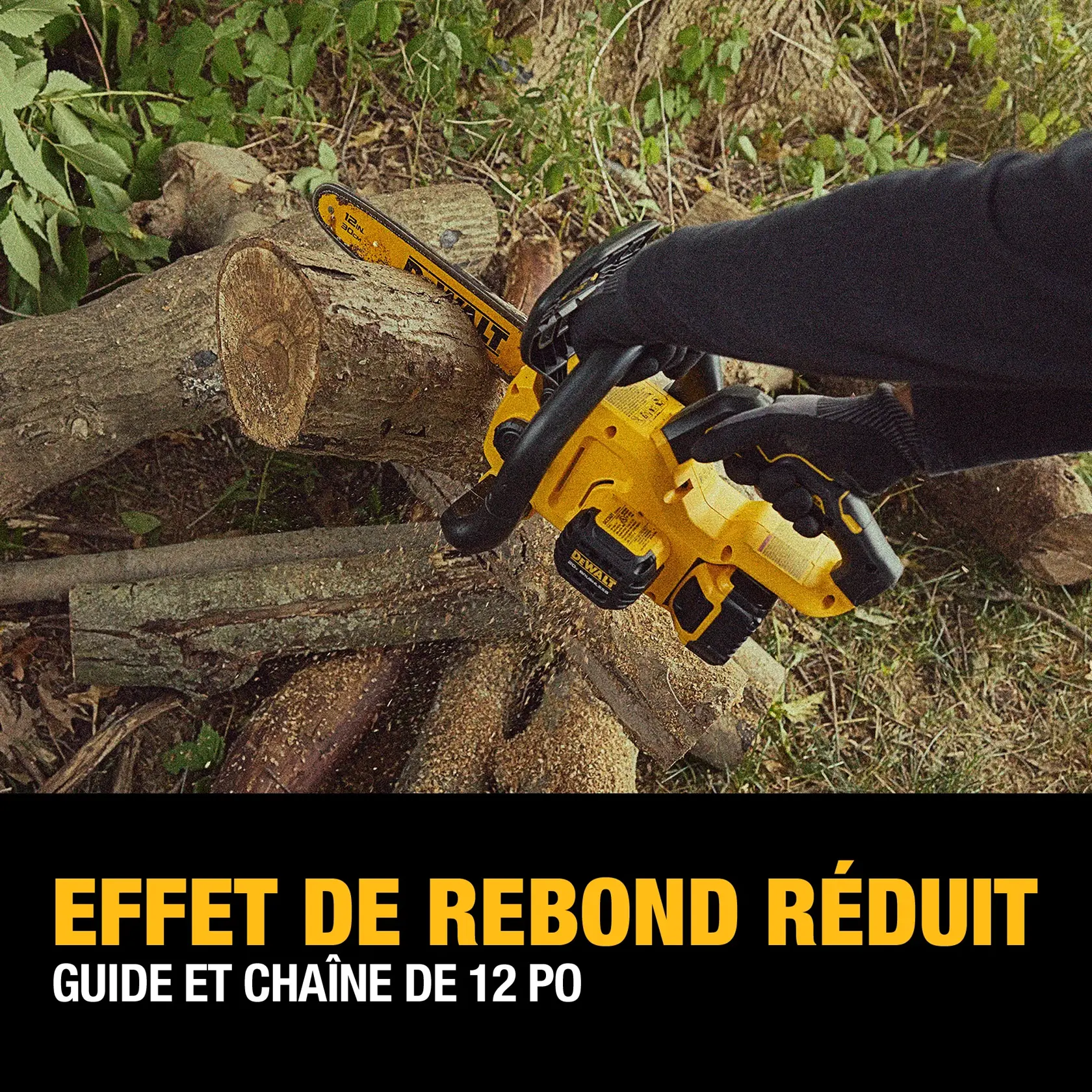 A person wearing gloves uses a yellow DEWALT cordless chainsaw with a 12-inch low kickback bar and chain to cut logs outdoors. Marketing text at the bottom highlights 'LOW KICKBACK' and '12 IN. LOW KICKBACK BAR AND CHAIN'.