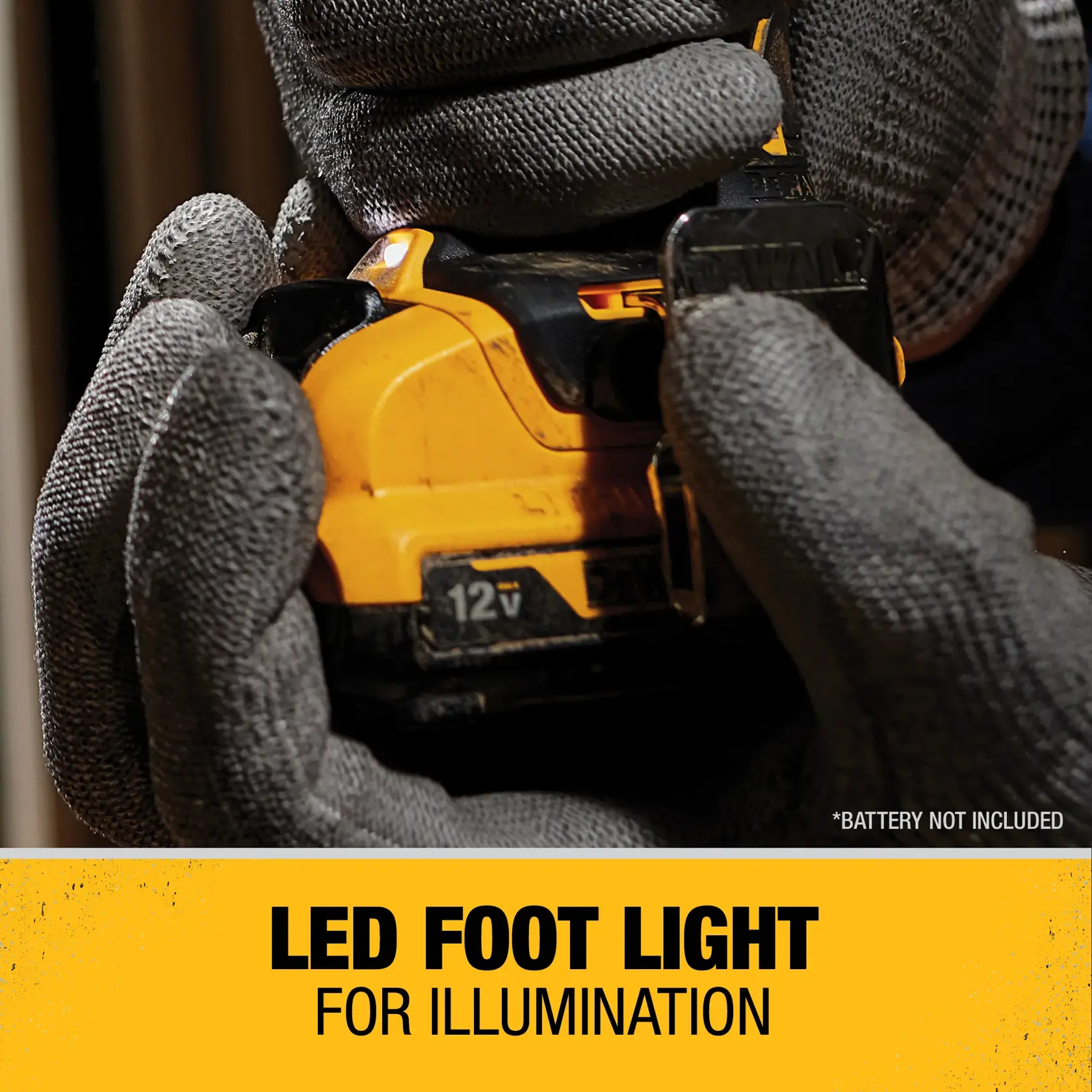 Close-up of gloved hands holding a DEWALT 12V power tool, highlighting the LED foot light feature. The text at the bottom reads 'LED FOOT LIGHT FOR ILLUMINATION'.