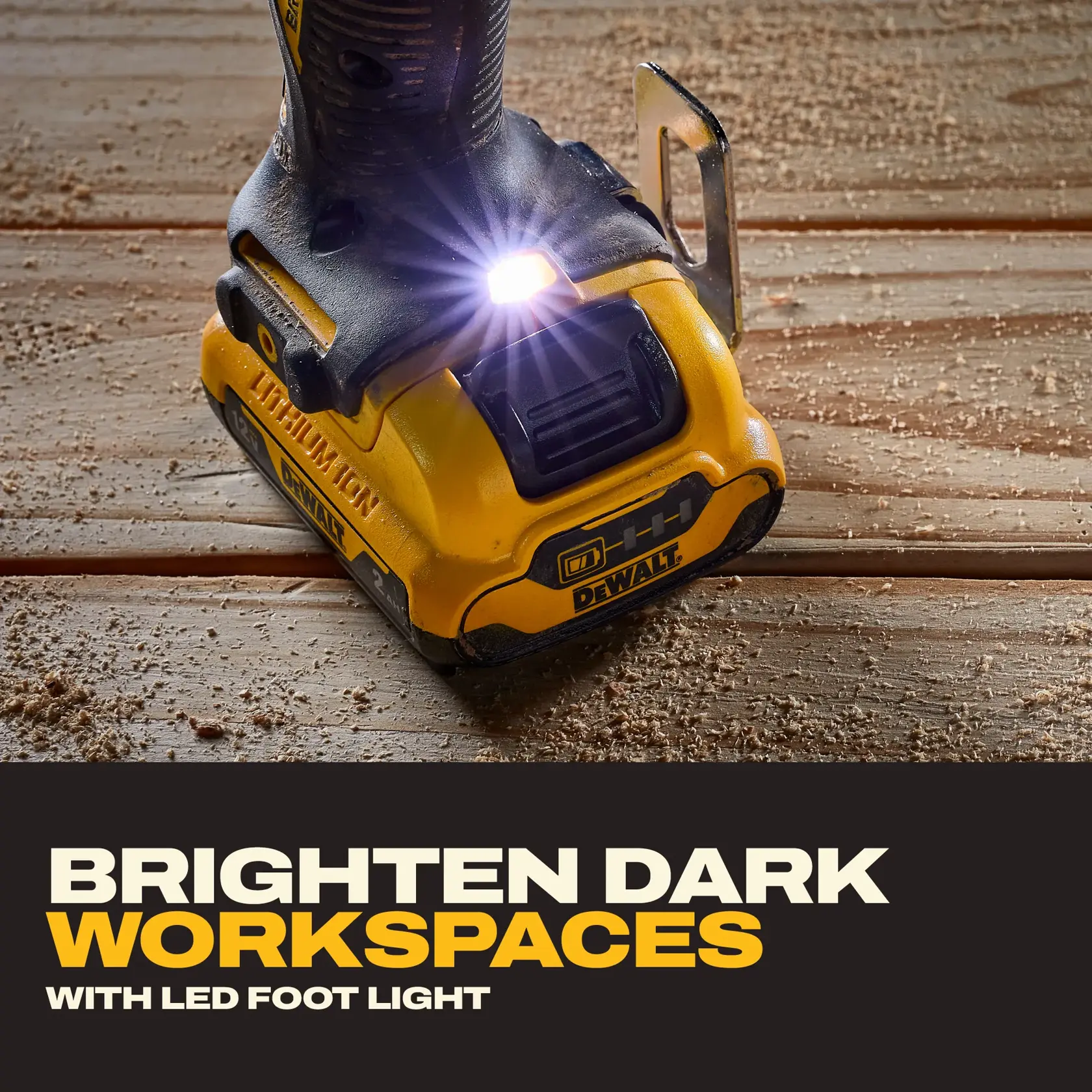 DEWALT drill base with LED foot light shining on wood surface, brightening workspace.