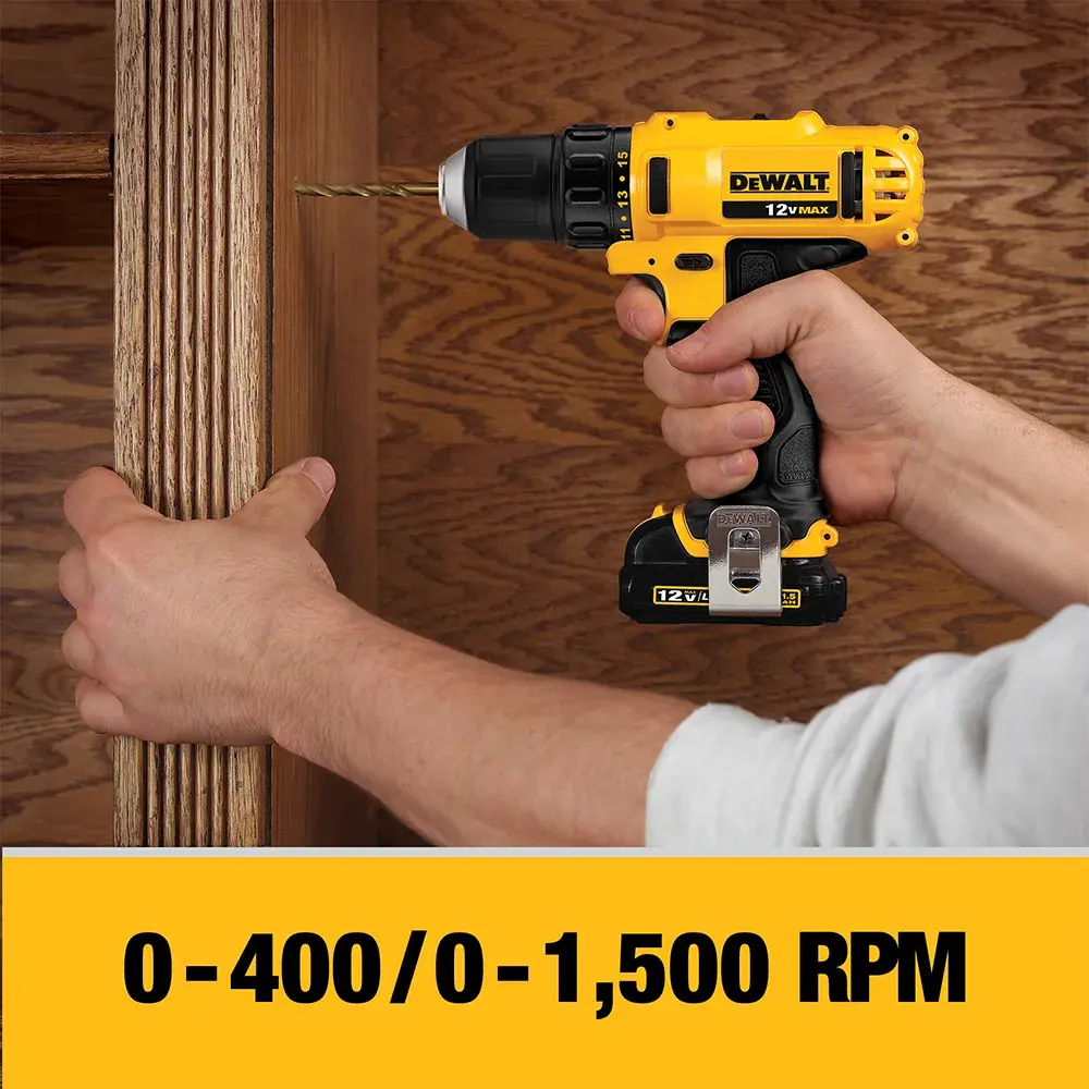 A person is using a yellow and black DEWALT cordless power drill to drill into wooden shelves. The tool's speed range, 0-400/0-1,500 RPM, is displayed in bold text at the bottom.