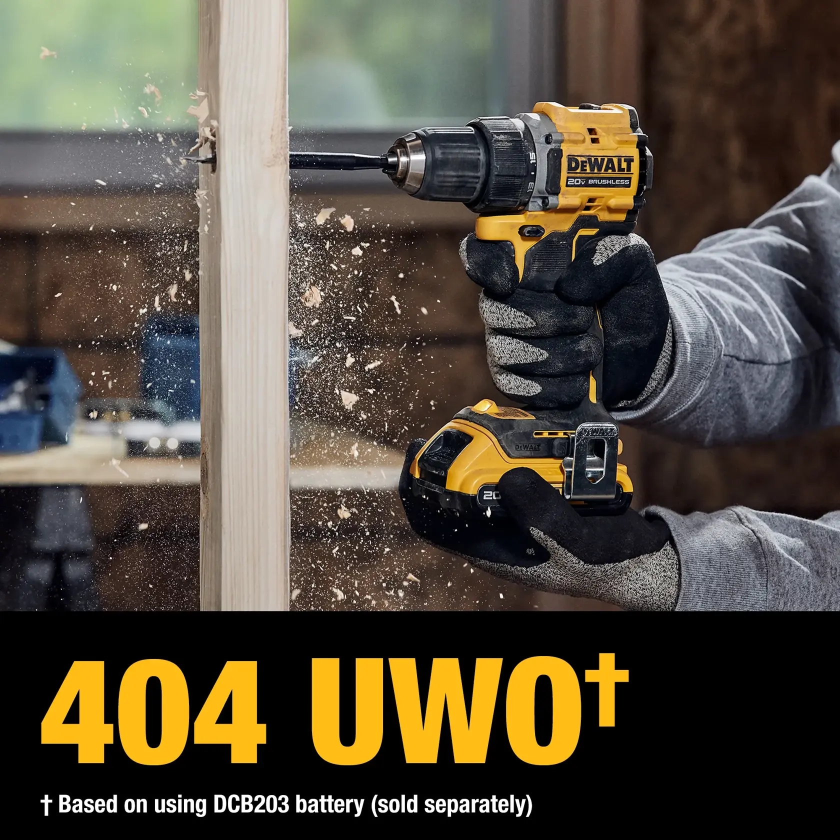 A person wearing gloves uses a yellow and black DEWALT 20V brushless cordless drill to drill into a piece of wood. Wood shavings are flying as the drill operates. Text at the bottom reads '404 UWO† Based on using DCB203 battery (sold separately)'.