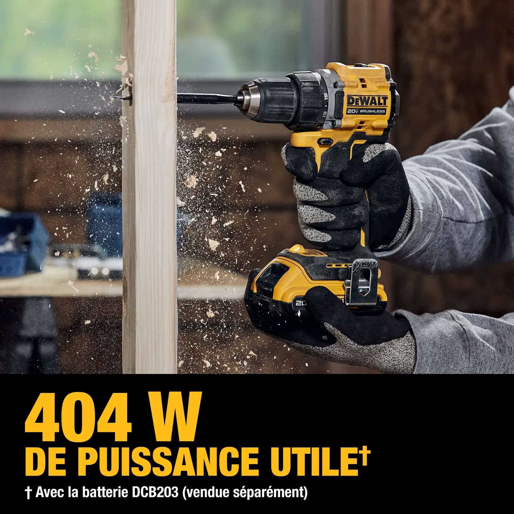 A person wearing gloves uses a yellow and black DEWALT 20V brushless cordless drill to drill into a piece of wood. Wood shavings are flying as the drill operates. Text at the bottom reads '404 UWO† Based on using DCB203 battery (sold separately)'.