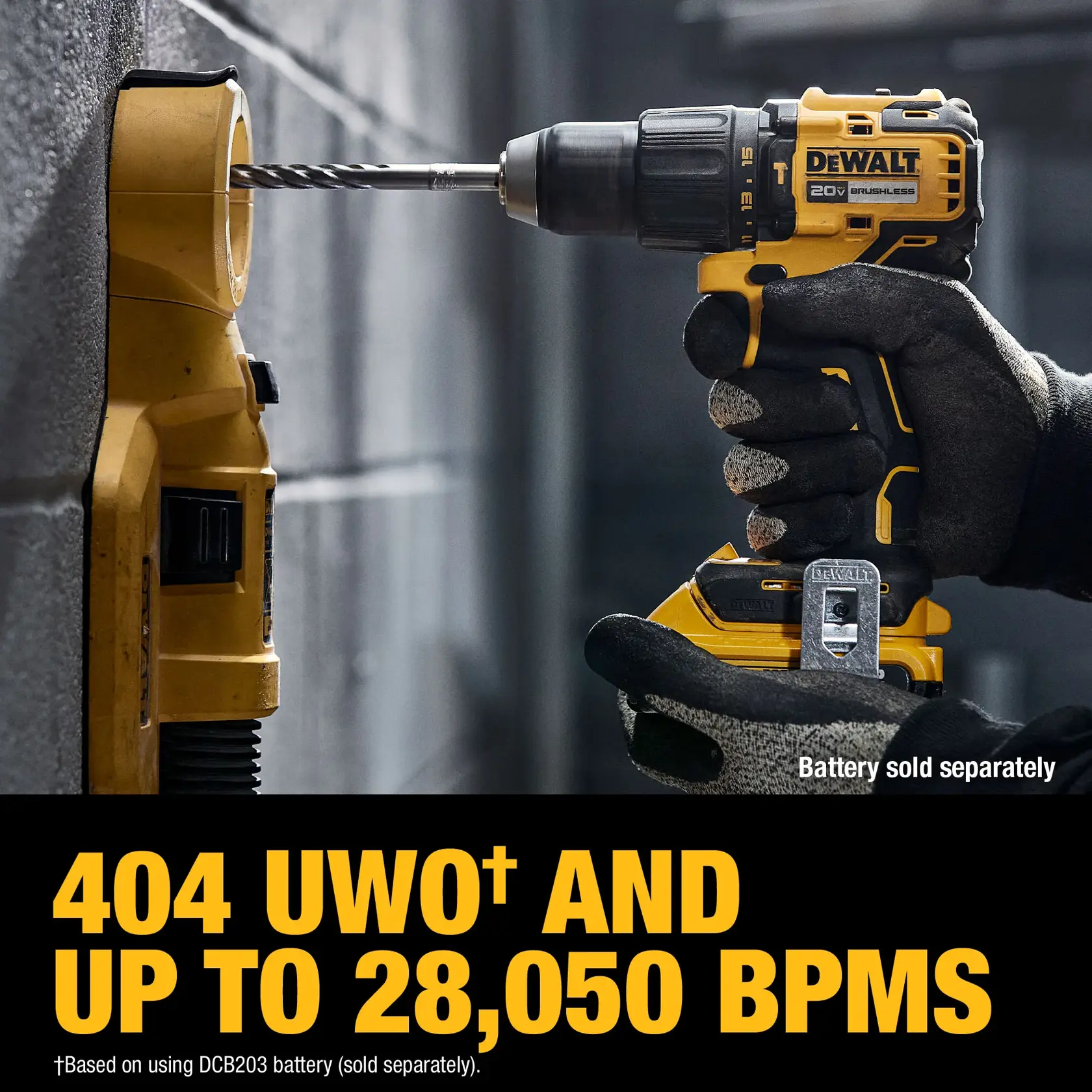 A person wearing gloves is using a DEWALT 20V brushless cordless drill to drill into a concrete wall. The drill is yellow and black, and the text on the image highlights '404 UWO and up to 28,050 BPM.' Battery is sold separately.