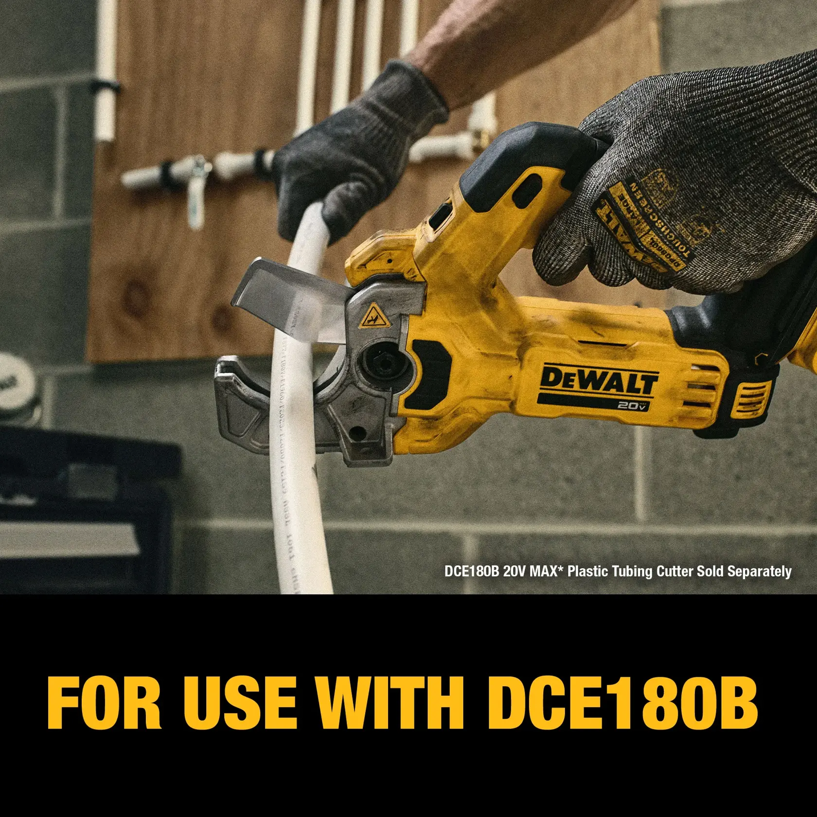 A person wearing gloves uses a DEWALT 20V MAX power tool to cut a plastic pipe in a workshop setting. The image includes text indicating that the product is for use with DCE180B.