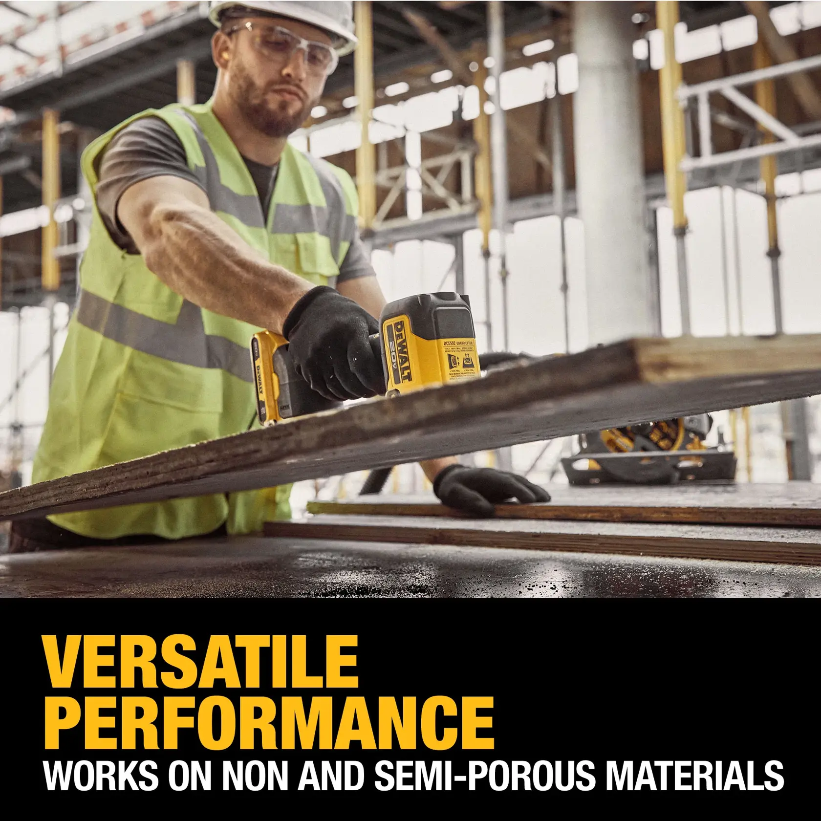 A person wearing a high-visibility vest and gloves is using a DEWALT power tool on a construction site. The focus is on the tool working on a large piece of material. Text on the image reads: 'Versatile performance. Works on non and semi-porous materials.'