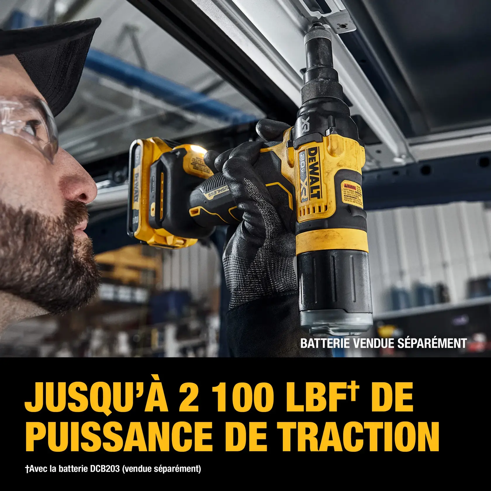 A person using a DEWALT cordless power tool, model DCF403B, to pull or install a fastener on a metal frame indoors. The tool is yellow and black, and the image highlights its pulling force of up to 2,100 lbf. Text notes that the battery is sold separately.