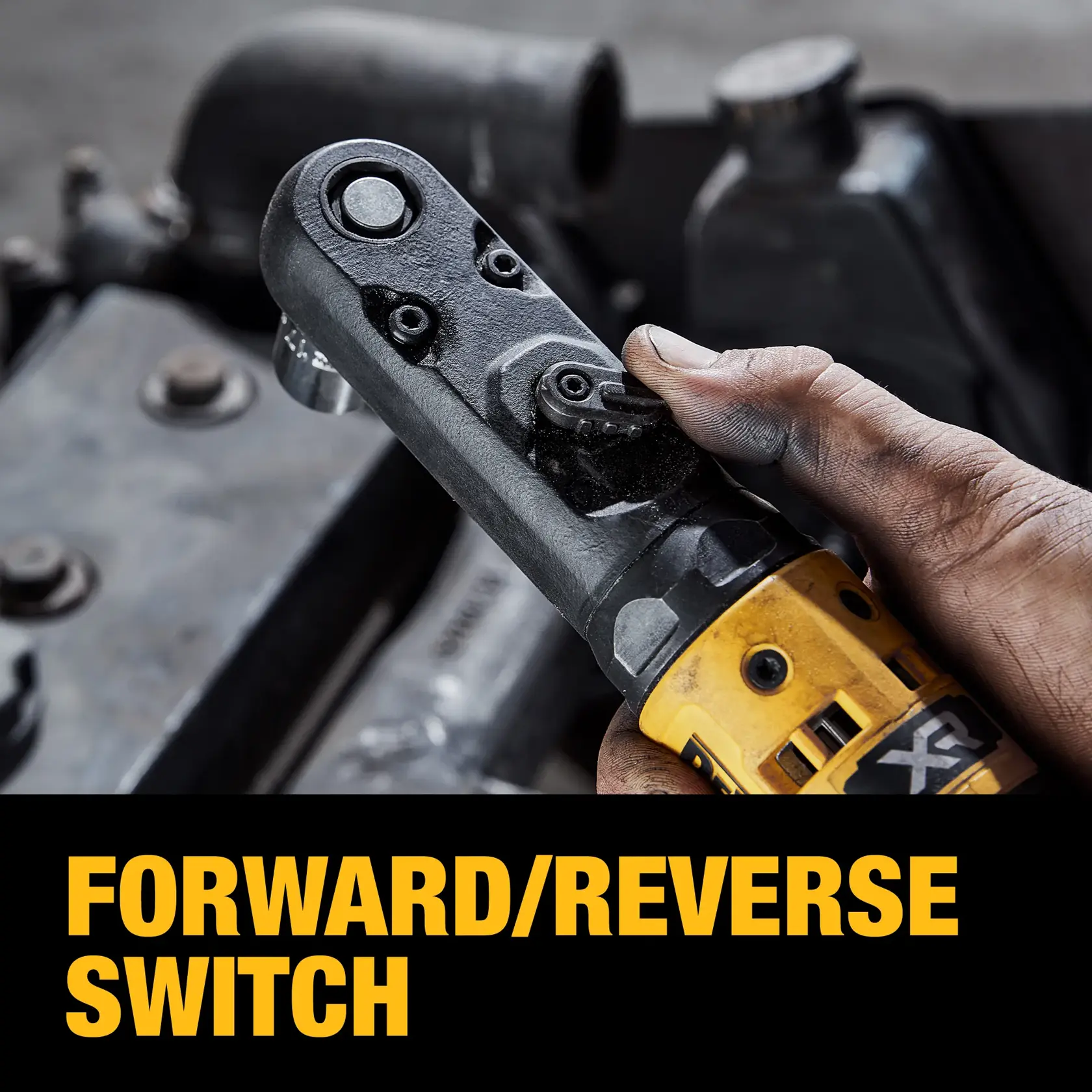 Close-up of a person's hand operating the forward/reverse switch on a yellow DEWALT power tool, with the text 'FORWARD/REVERSE SWITCH' below.