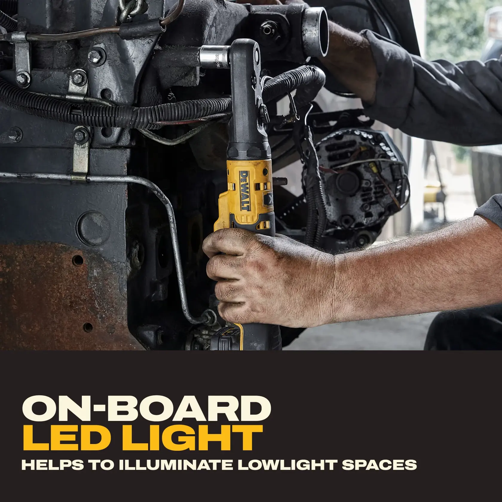 DEWALT DCF510B ratchet tool used on machinery, showing the on-board LED light feature for lowlight spaces.