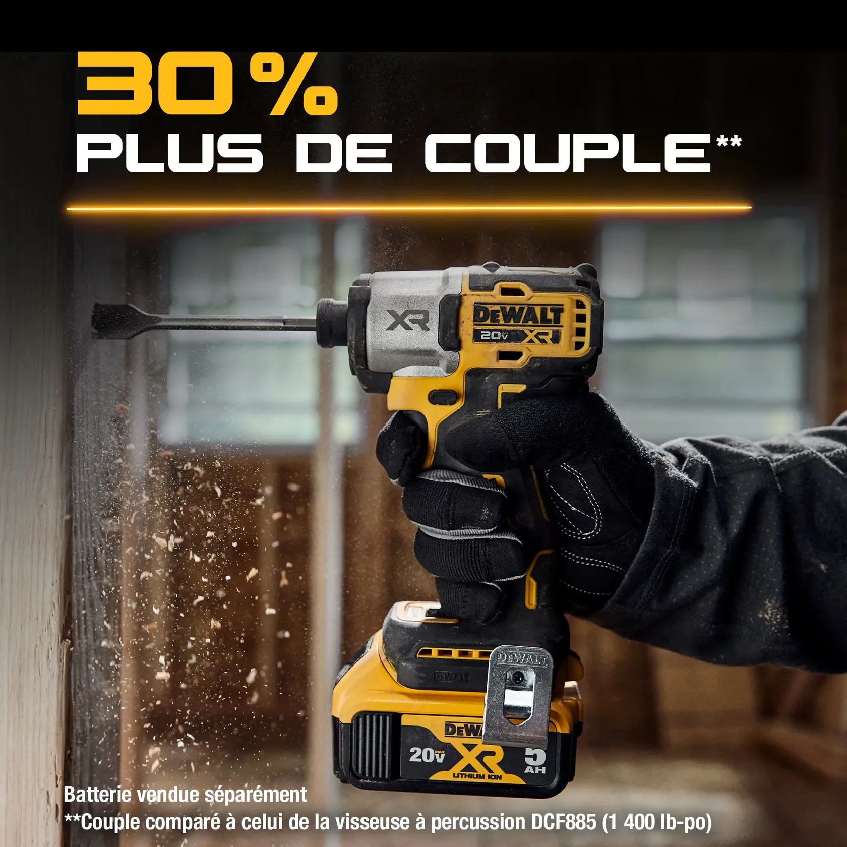 A gloved hand is holding a DEWALT 20V XR impact driver, drilling into a wooden surface, with wood shavings flying. The image highlights the product's feature, stating '30% More Torque' in bold text. Additional text at the bottom mentions that the battery is sold separately and compares the torque to the DCF885 impact driver.