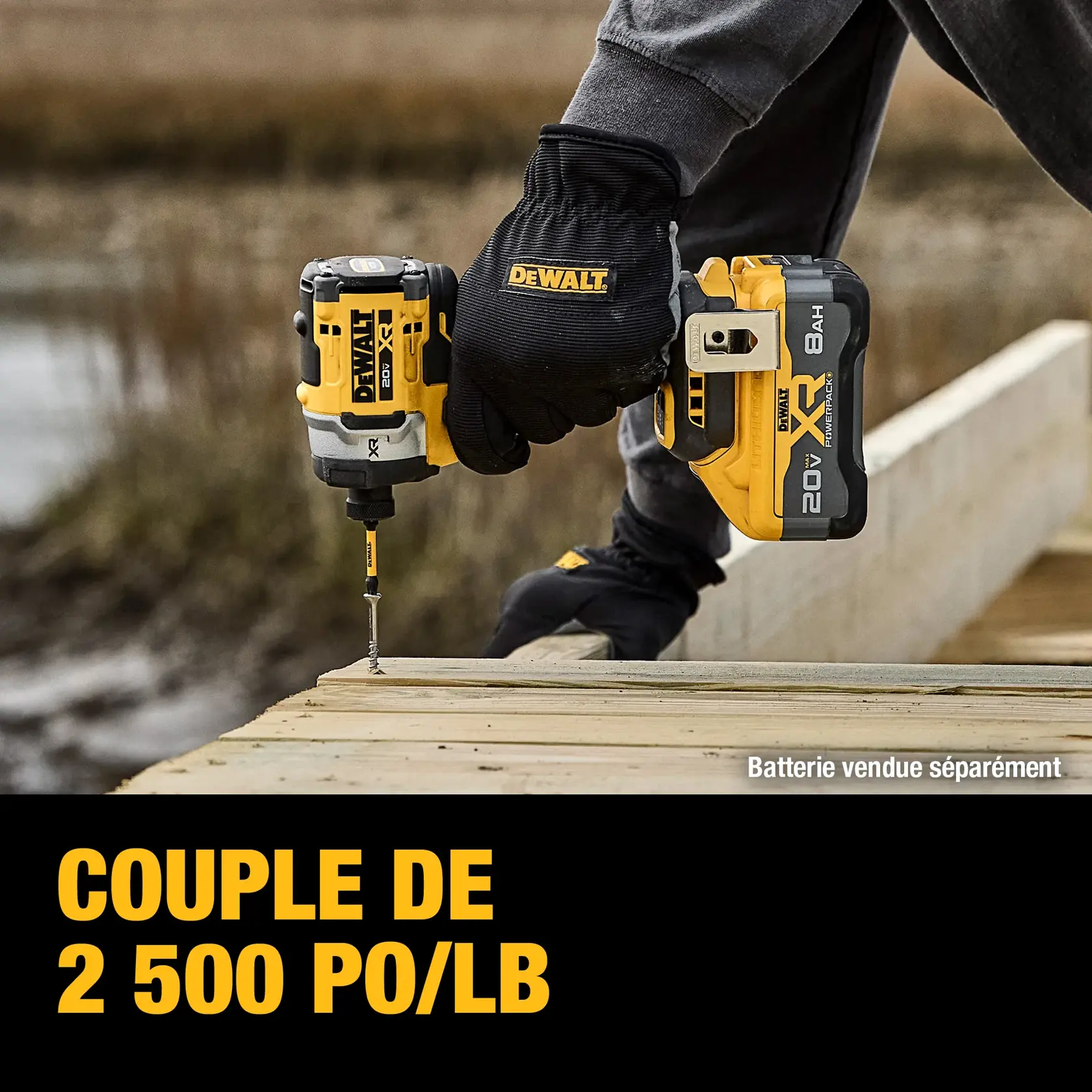 A close-up view of a person using a DEWALT XR cordless impact driver to drive a screw into wooden framing at a construction site. Text on the image highlights 'Up to 63% Faster Driving' compared to another model, and notes that the battery is sold separately.