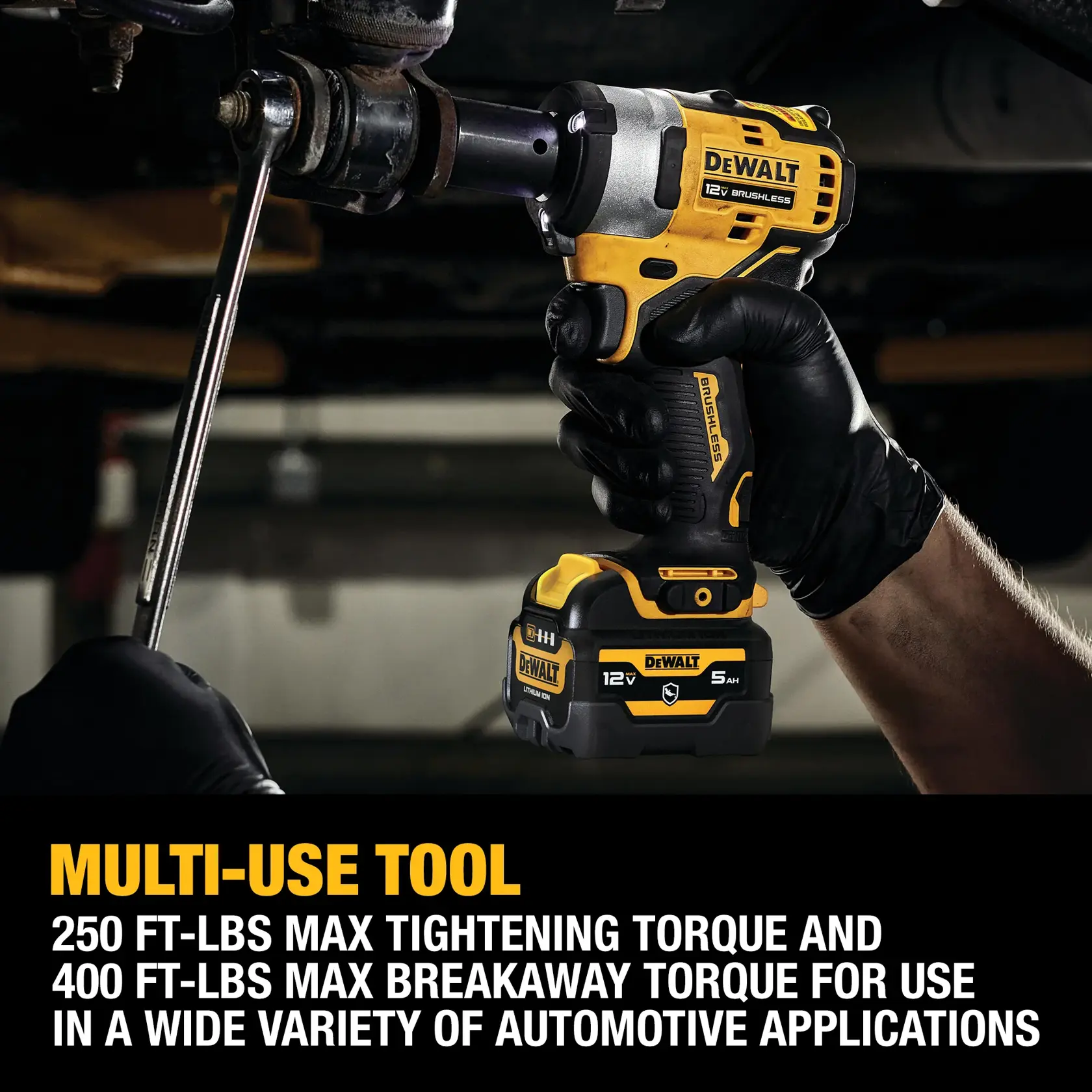 A person wearing black gloves is using a DEWALT 12V brushless cordless impact wrench, tightening a bolt on automotive machinery. Text on the image highlights the tool’s max tightening torque of 250 ft-lbs and max breakaway torque of 400 ft-lbs for use in various automotive applications.