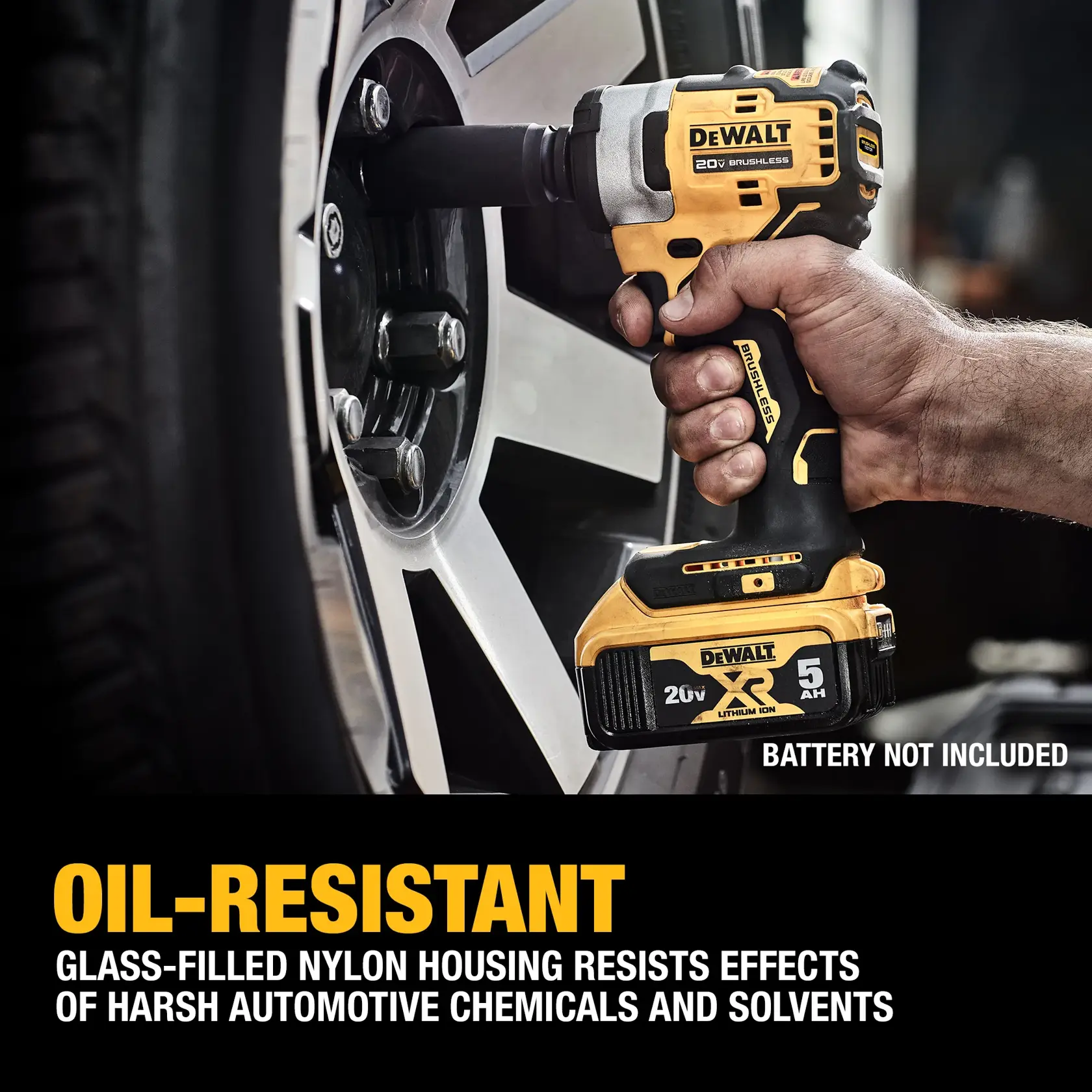 A hand using a DEWALT 20V cordless impact wrench to loosen or tighten a lug nut on a car wheel. The image highlights the oil-resistant feature of the tool's glass-filled nylon housing, which resists harsh automotive chemicals and solvents. The battery is not included.