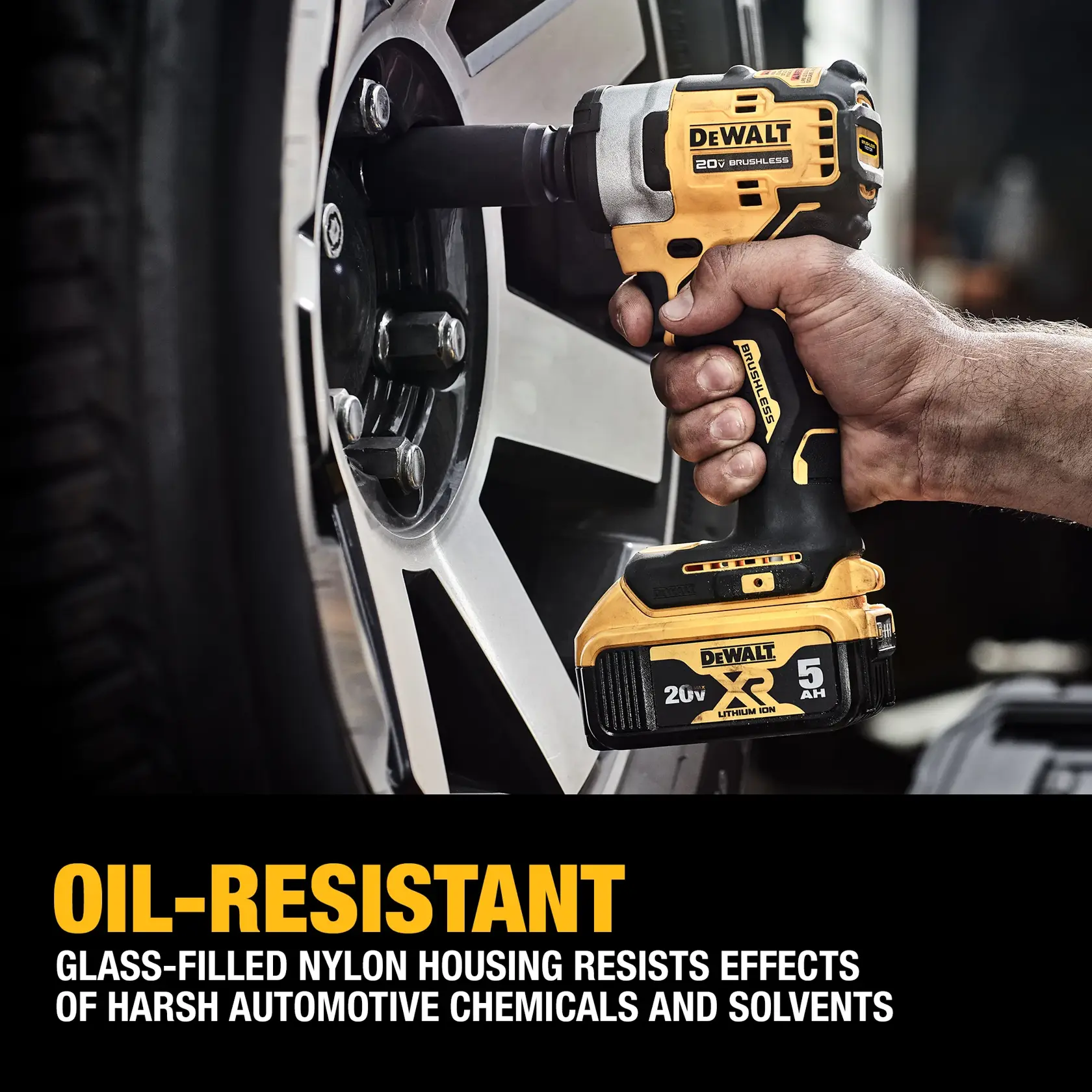 A DEWALT 20V brushless cordless impact wrench being used to loosen a lug nut on a car wheel. The product's oil-resistant feature and glass-filled nylon housing, which resists effects of harsh automotive chemicals and solvents, are highlighted in the text.