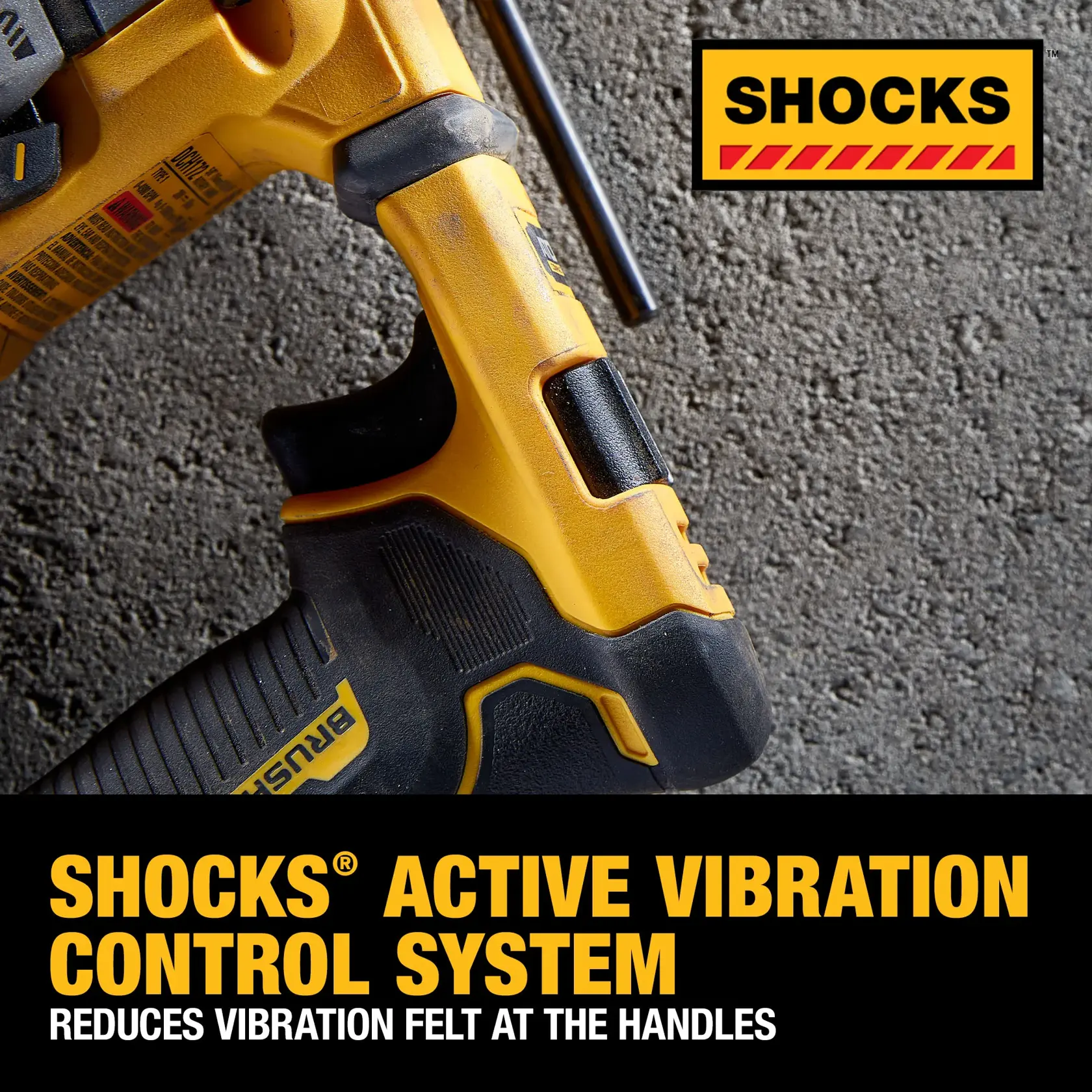Close-up of a DEWALT power tool handle on a concrete surface, highlighting the SHOCKS Active Vibration Control System, which reduces vibration felt at the handles.