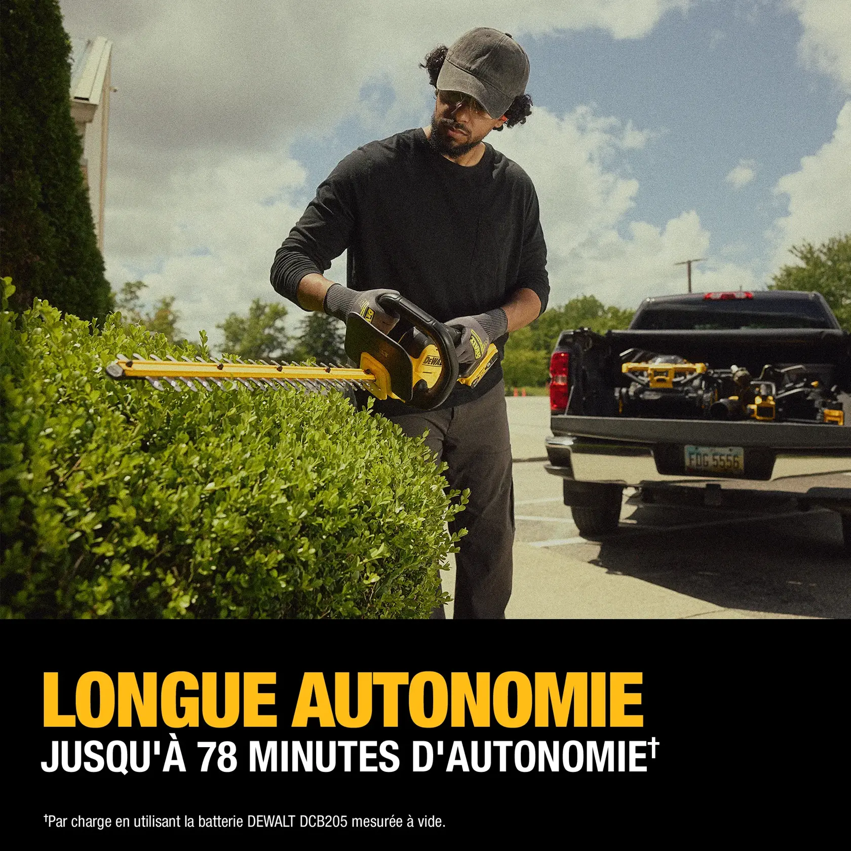 A person trimming a hedge with a DEWALT cordless hedge trimmer outdoors near a parked truck loaded with tools. Text on the image highlights 'LONG RUNTIME: UP TO 78 MINUTES OF RUNTIME.'