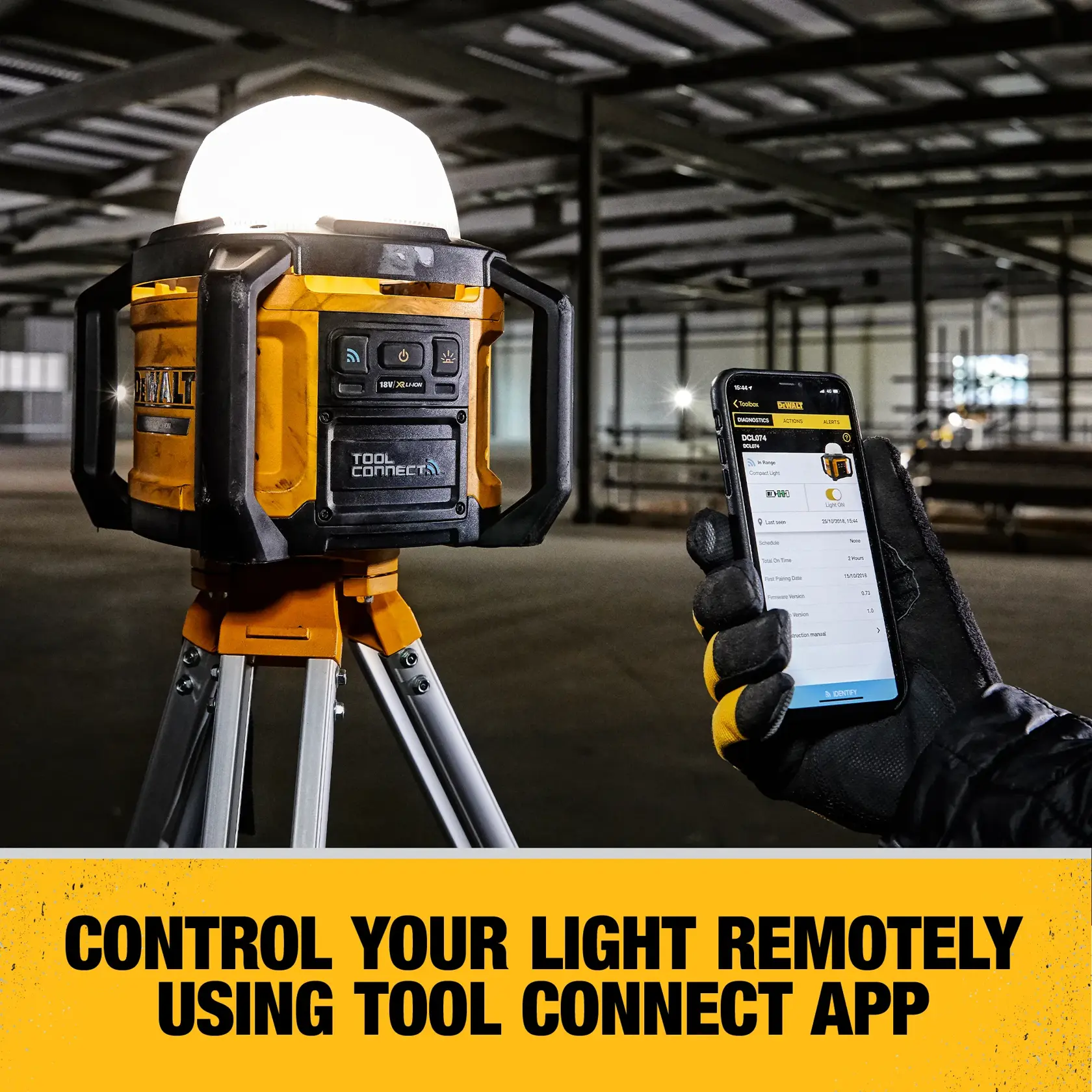 A DEWALT portable work light mounted on a tripod in an industrial setting. A gloved hand holds a smartphone displaying the Tool Connect app to control the light remotely. The text at the bottom reads: 'Control your light remotely using Tool Connect app.'