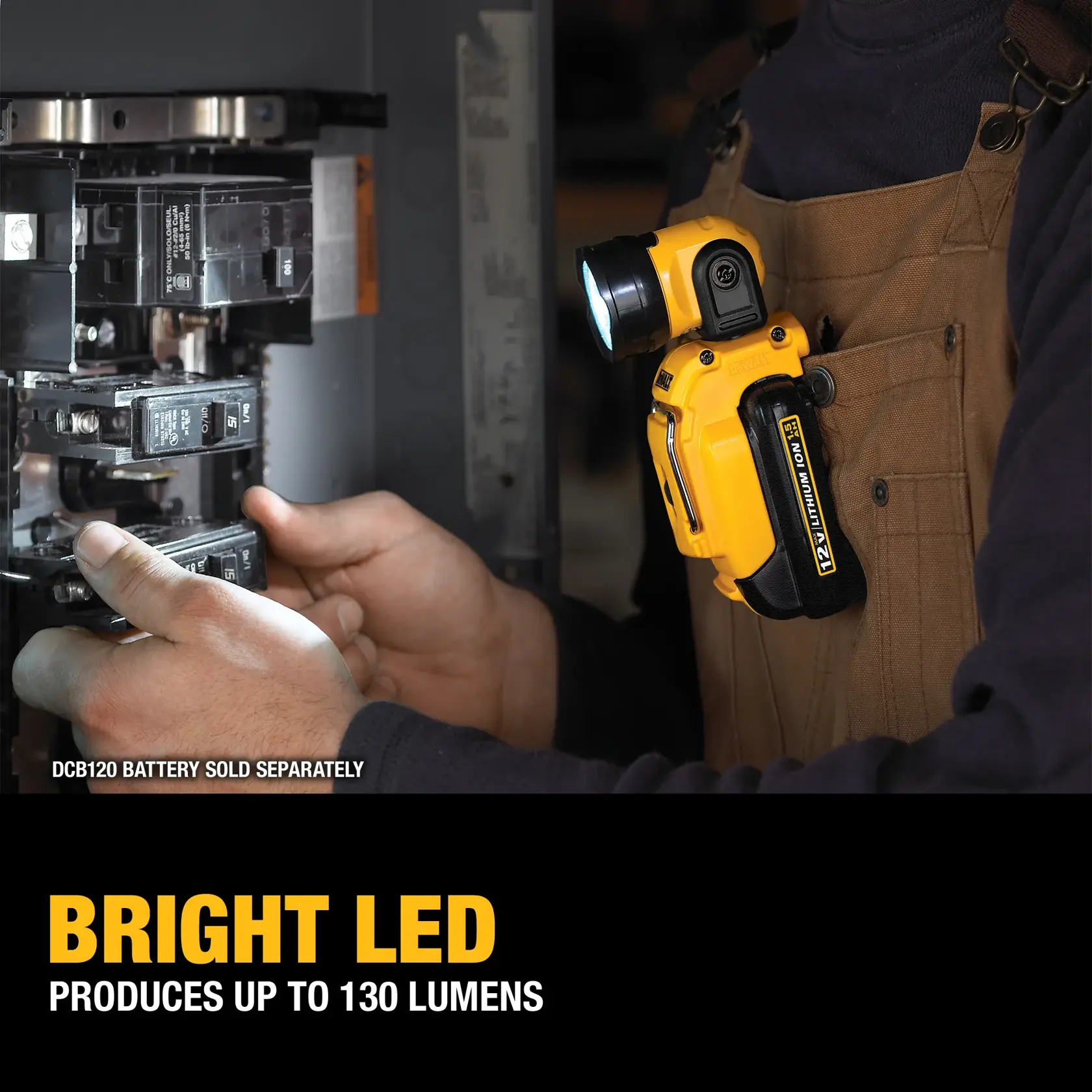 A DEWALT DCL510 12V Lithium Ion work light is positioned next to an open toolbox containing wrenches. Nearby, a person is using a ratchet to work on a metal surface or machinery part, illuminated by the work light.