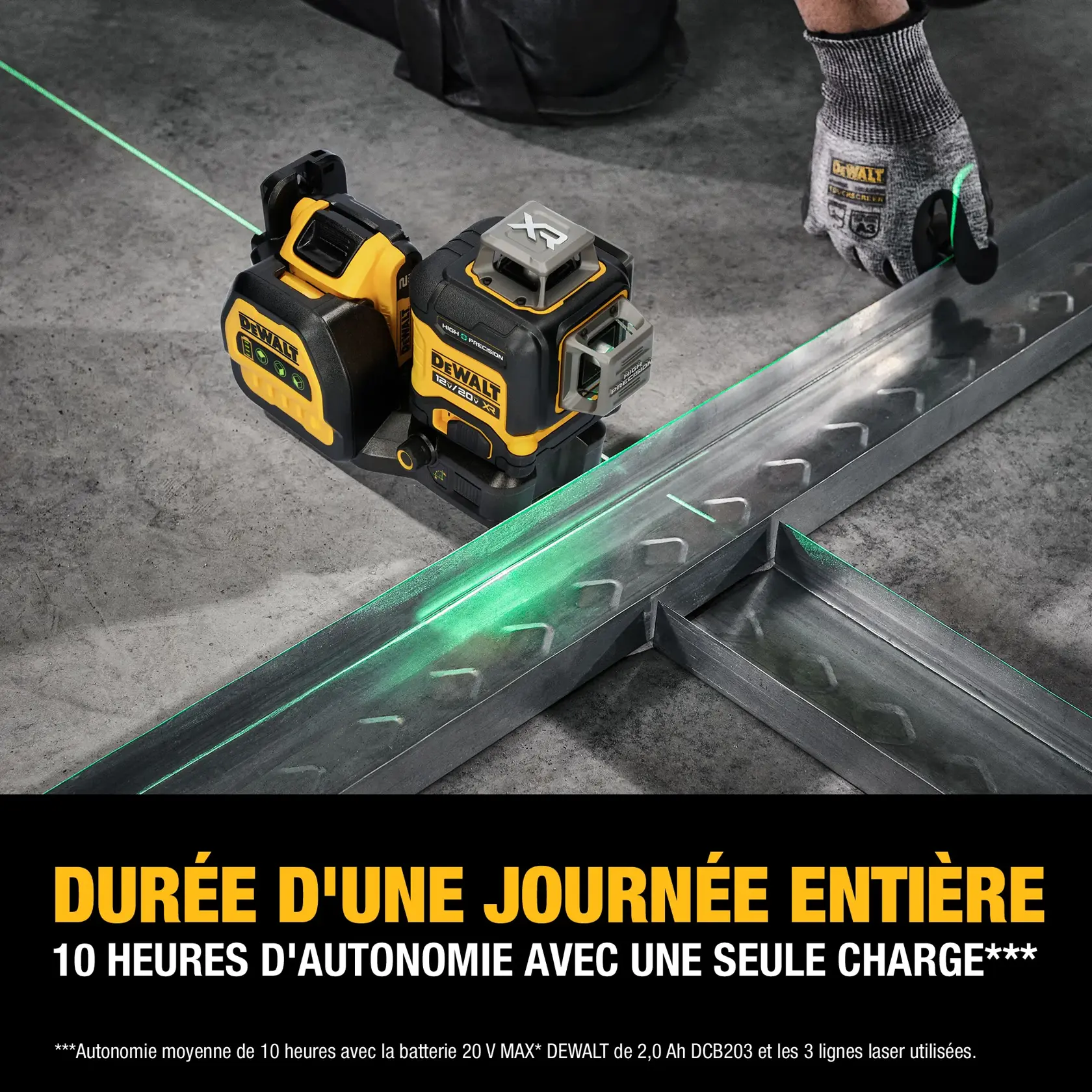 A DEWALT 20V MAX green laser level placed on a concrete floor, projecting bright green laser lines to mark metal framing pieces. A gloved hand is adjusting the steel frames. The image highlights the product's battery, promising 10 hours of runtime on a single charge.