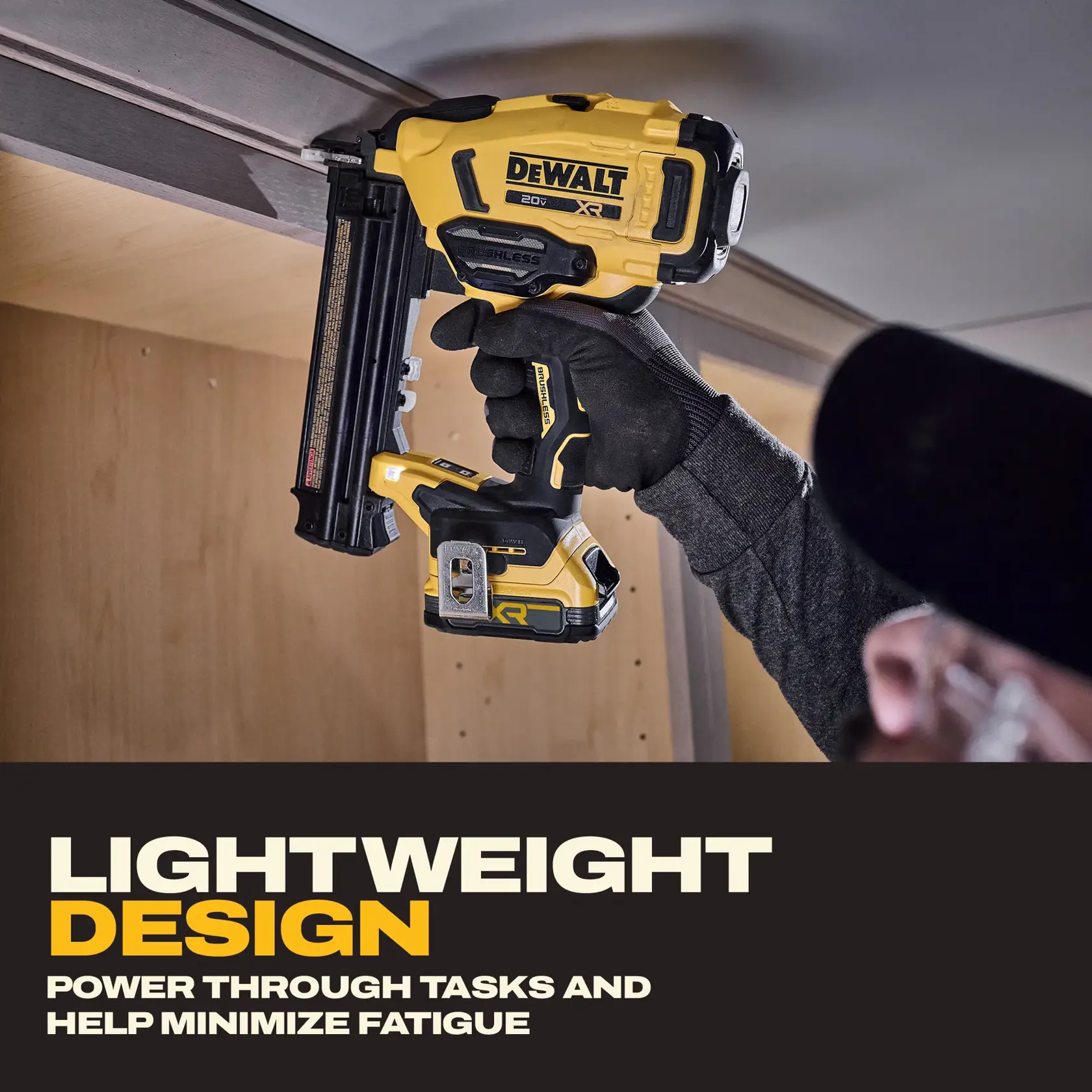 DEWALT DCN210E1 cordless nail gun held by user, highlighting lightweight design for reduced fatigue.
