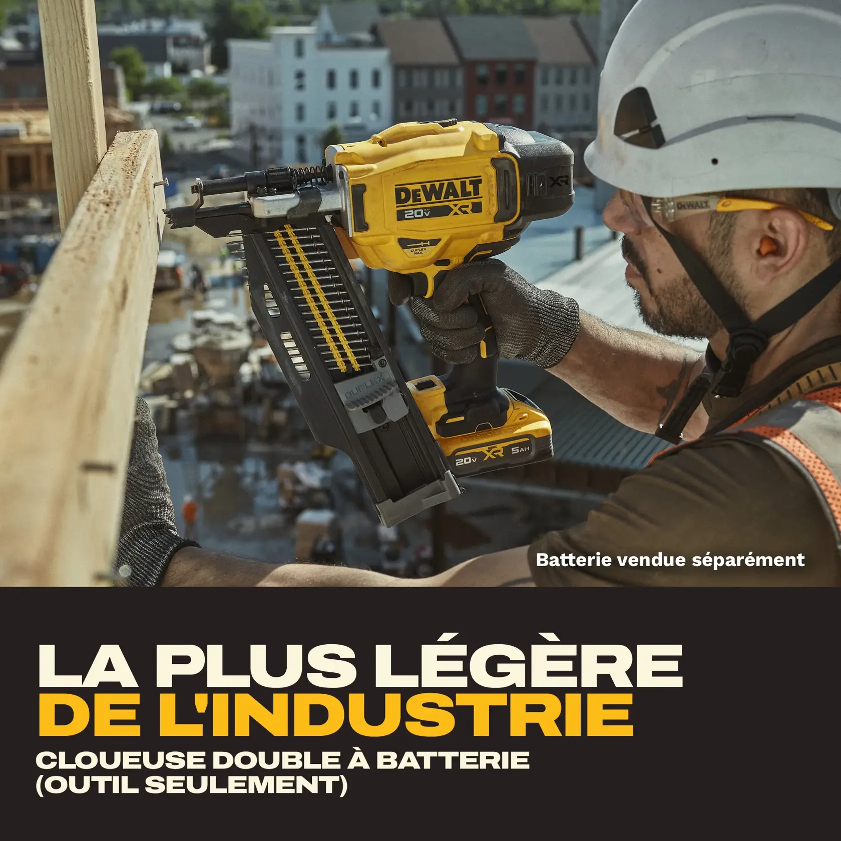 A construction worker uses a yellow DEWALT 20V XR battery-powered duplex nailer to secure a wooden beam at a building site. The tool is shown in close-up, with the background displaying construction equipment and buildings. Text on the image reads: 'Industry's Lightest Battery Powered Duplex Nailer (Tool Only)', indicating the battery is sold separately.