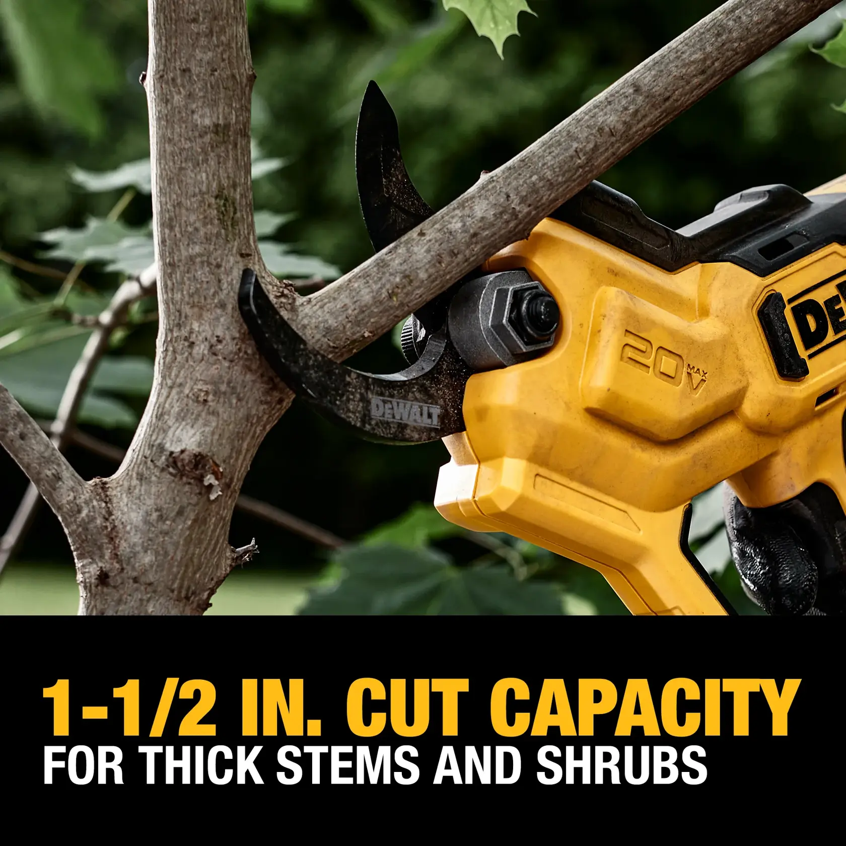 A close-up of a DEWALT 20V power tool cutting a thick tree branch. The tool highlights a 1-1/2 inch cut capacity for thick stems and shrubs, with bold yellow and black branding on the device.