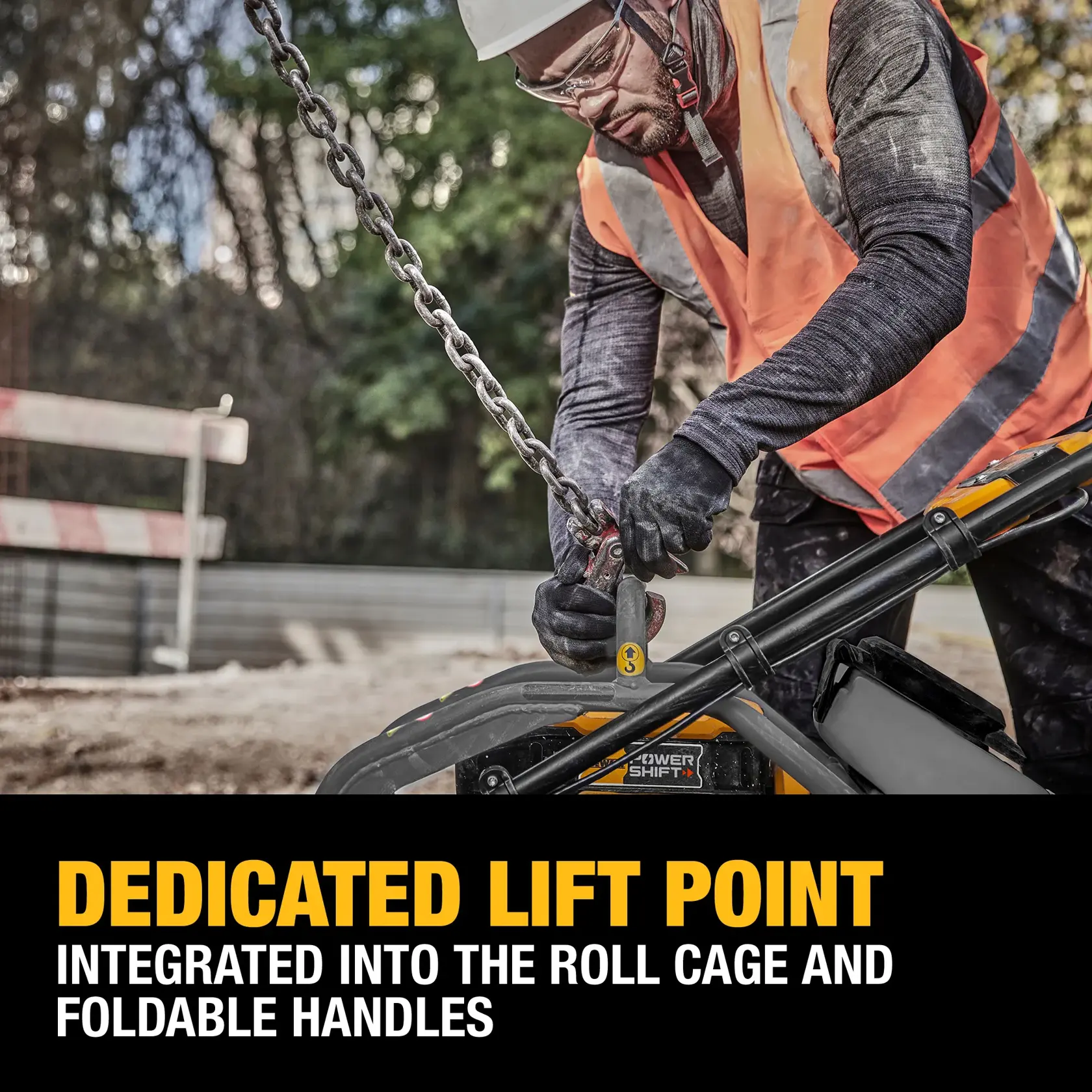 A construction worker wearing a safety vest and gloves attaches a lifting chain to the dedicated lift point on a DEWALT machine. The lift point is integrated into the roll cage and foldable handles. The foreground contains bold text describing the dedicated lift point feature.