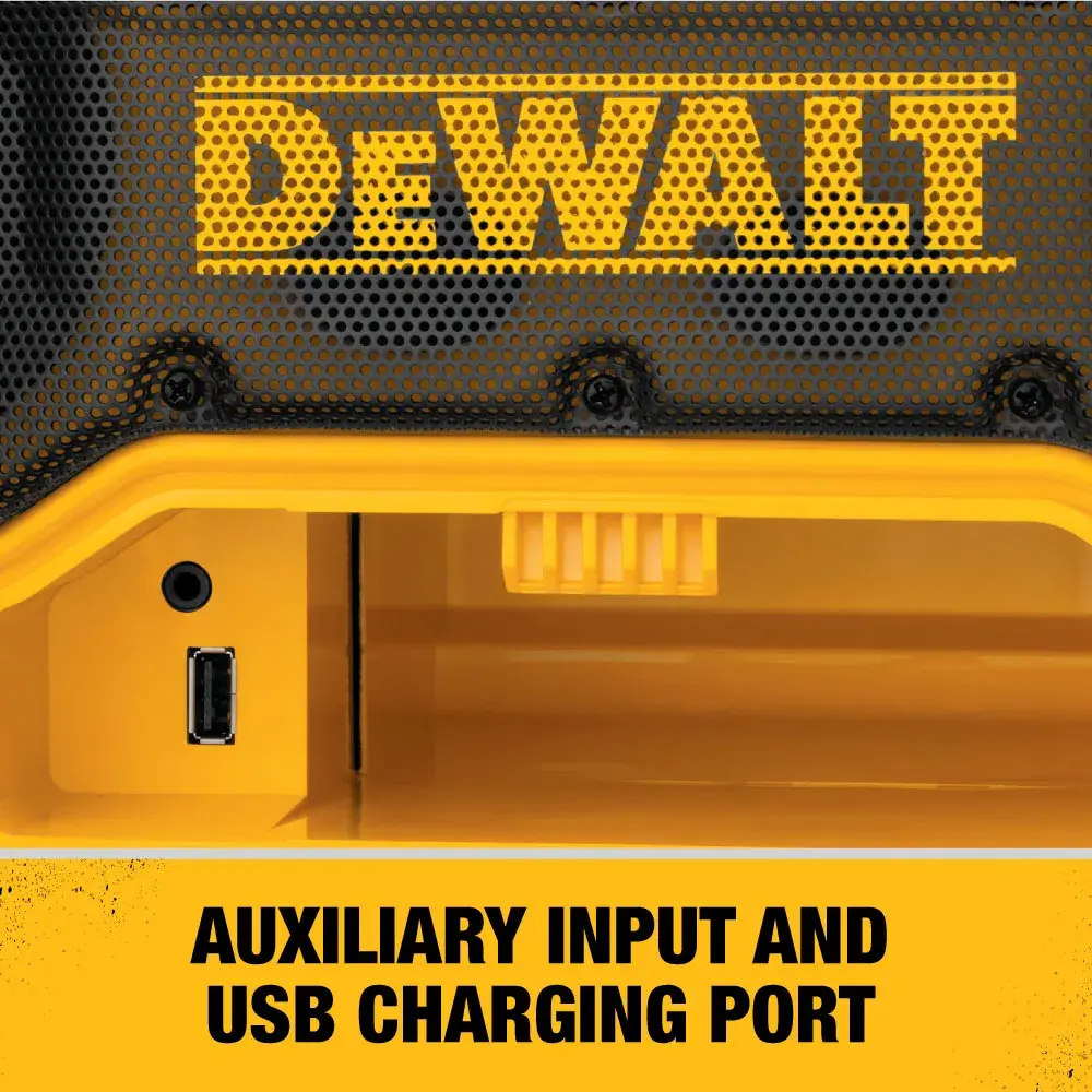 Close-up image of a DEWALT device showing an auxiliary input and a USB charging port. The text below reads: 'AUXILIARY INPUT AND USB CHARGING PORT.'