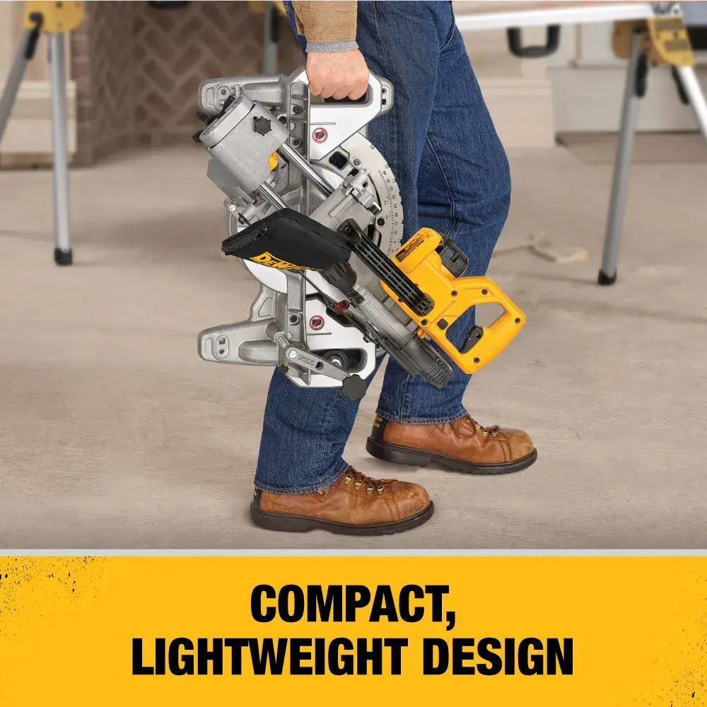 Person holding a DEWALT miter saw, emphasizing its compact and lightweight design for easy transport.