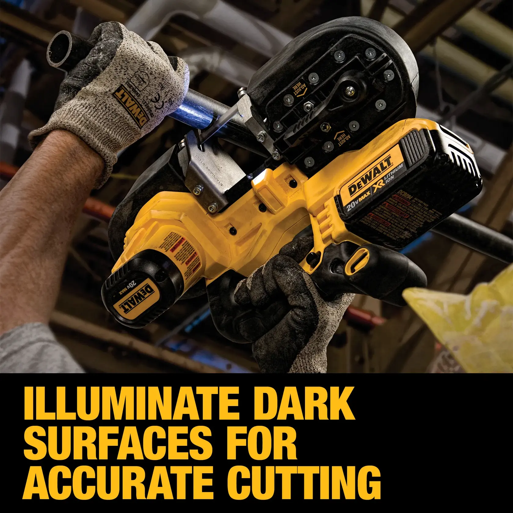 A person wearing gloves is using a DEWALT cordless portable band saw to cut a metal pipe. The scene demonstrates the saw’s built-in light illuminating a dark work area for improved cutting accuracy. The text on the image says, 'Illuminate dark surfaces for accurate cutting.'