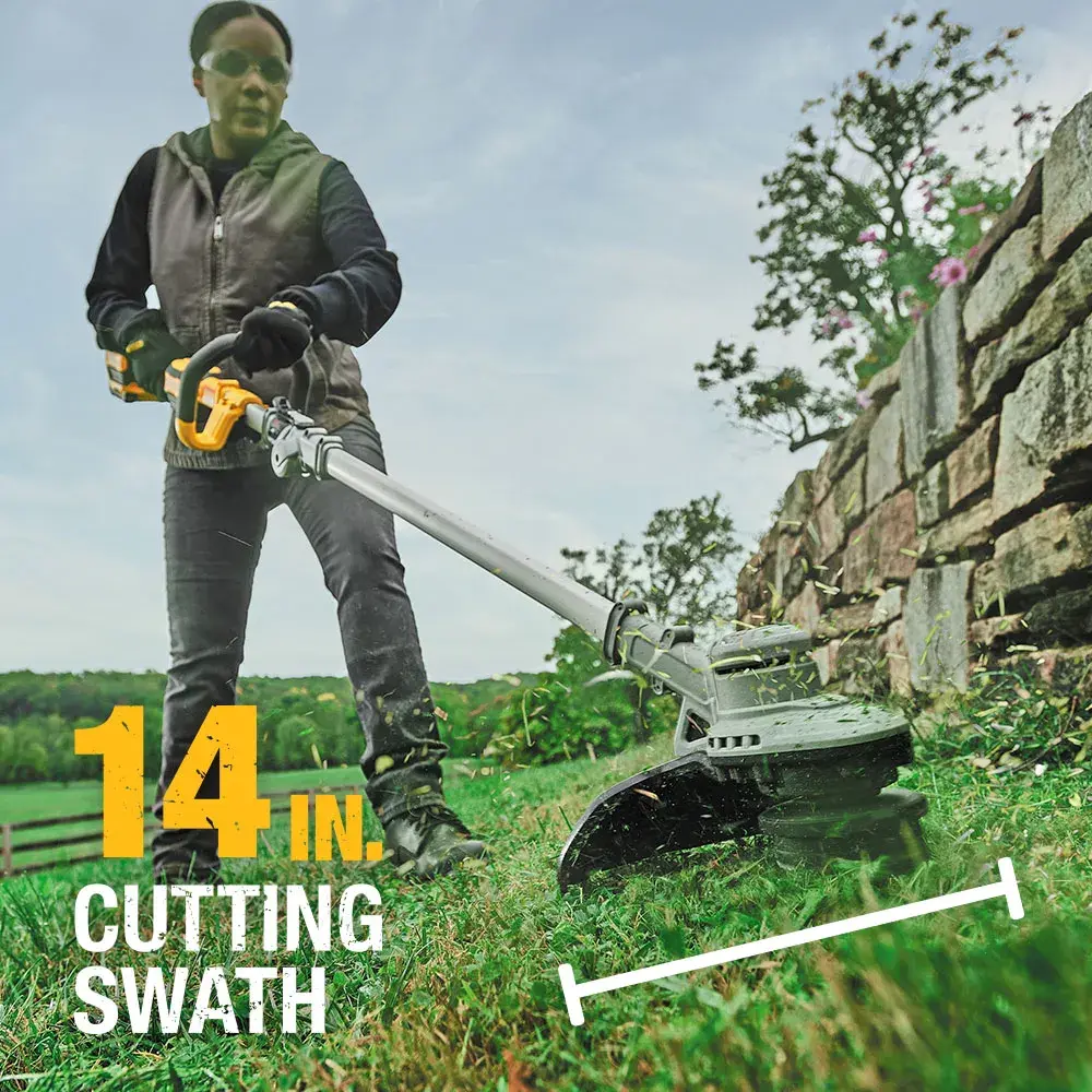 Person using a DEWALT string trimmer outdoors, showing 14 inch cutting swath near a stone wall.