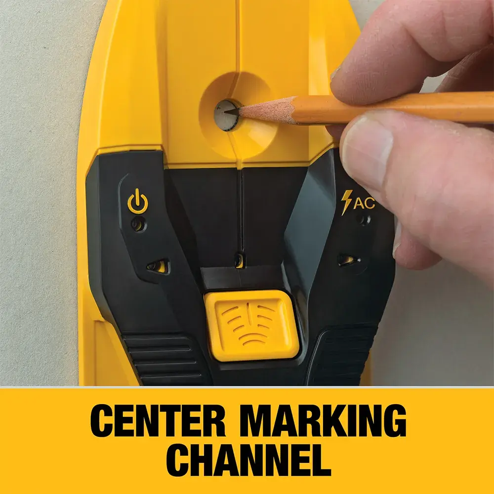 A close-up of a hand holding a pencil, marking the center point through the marking channel of a yellow and black DEWALT device pressed against a wall. The text 'CENTER MARKING CHANNEL' is displayed below.