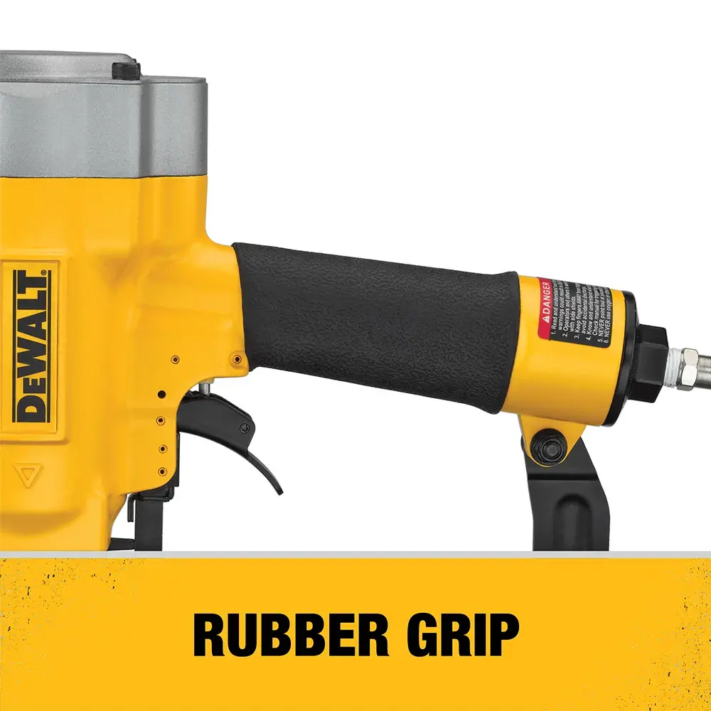 Close-up side view of a DEWALT tool with a black rubber grip handle, featuring the DEWALT logo and a yellow label below that reads 'RUBBER GRIP.'