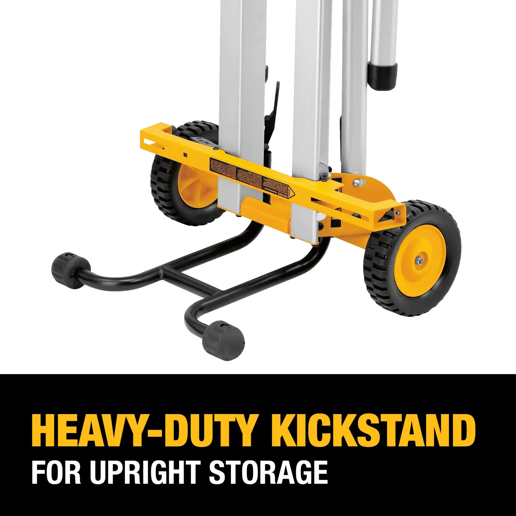 Close-up of a DEWALT heavy-duty kickstand attached to a wheeled stand, showing its use for upright storage. The kickstand is black metal and the wheels are yellow with black treads. Text below reads 'HEAVY-DUTY KICKSTAND FOR UPRIGHT STORAGE'.