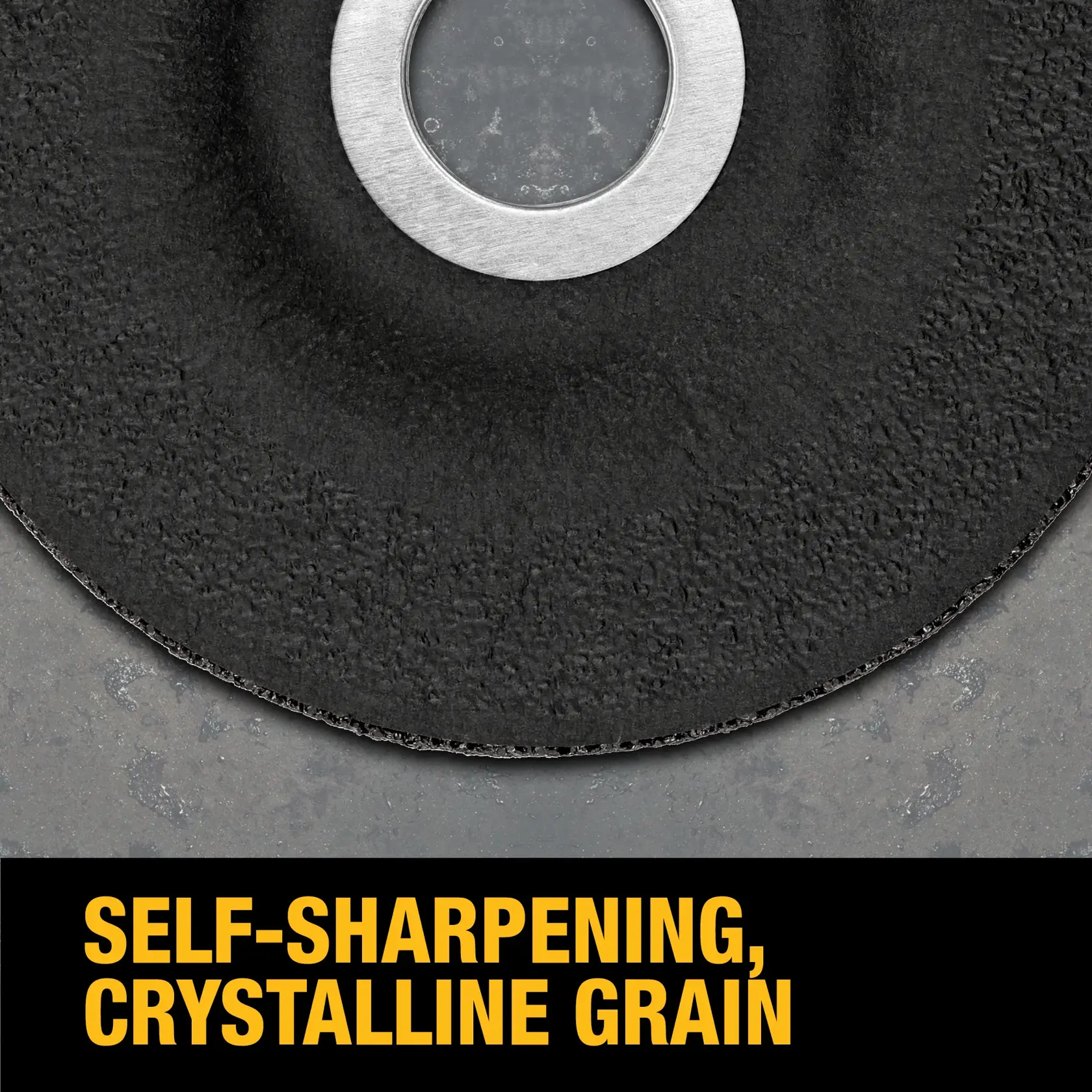 Close-up view of a DEWALT grinding wheel showing its textured surface and metal center, with the text 'SELF-SHARPENING, CRYSTALLINE GRAIN' in bold yellow letters at the bottom.