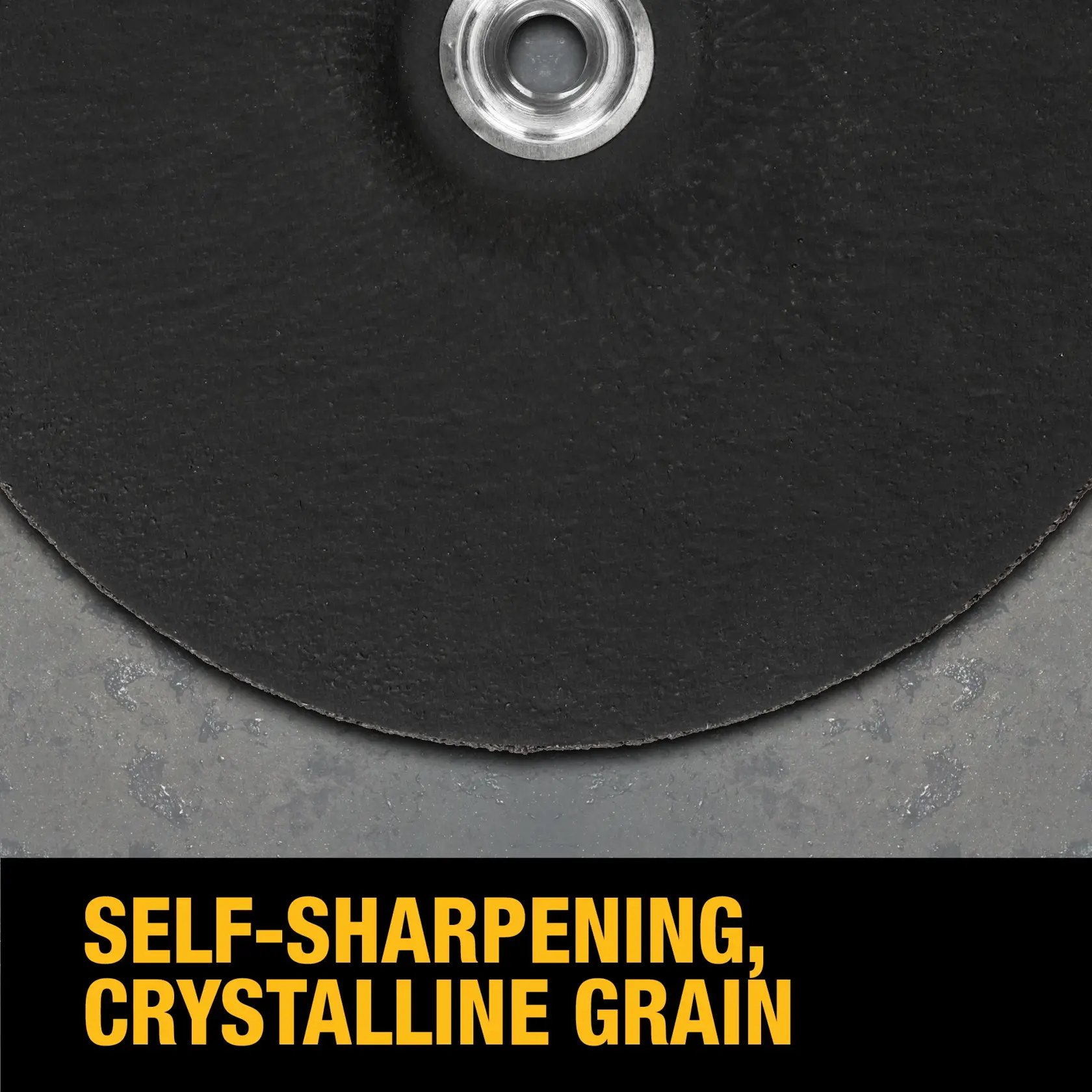 Close-up of a DEWALT cutting or grinding wheel with a metal center, showing the text 'SELF-SHARPENING, CRYSTALLINE GRAIN' in bold yellow letters at the bottom.