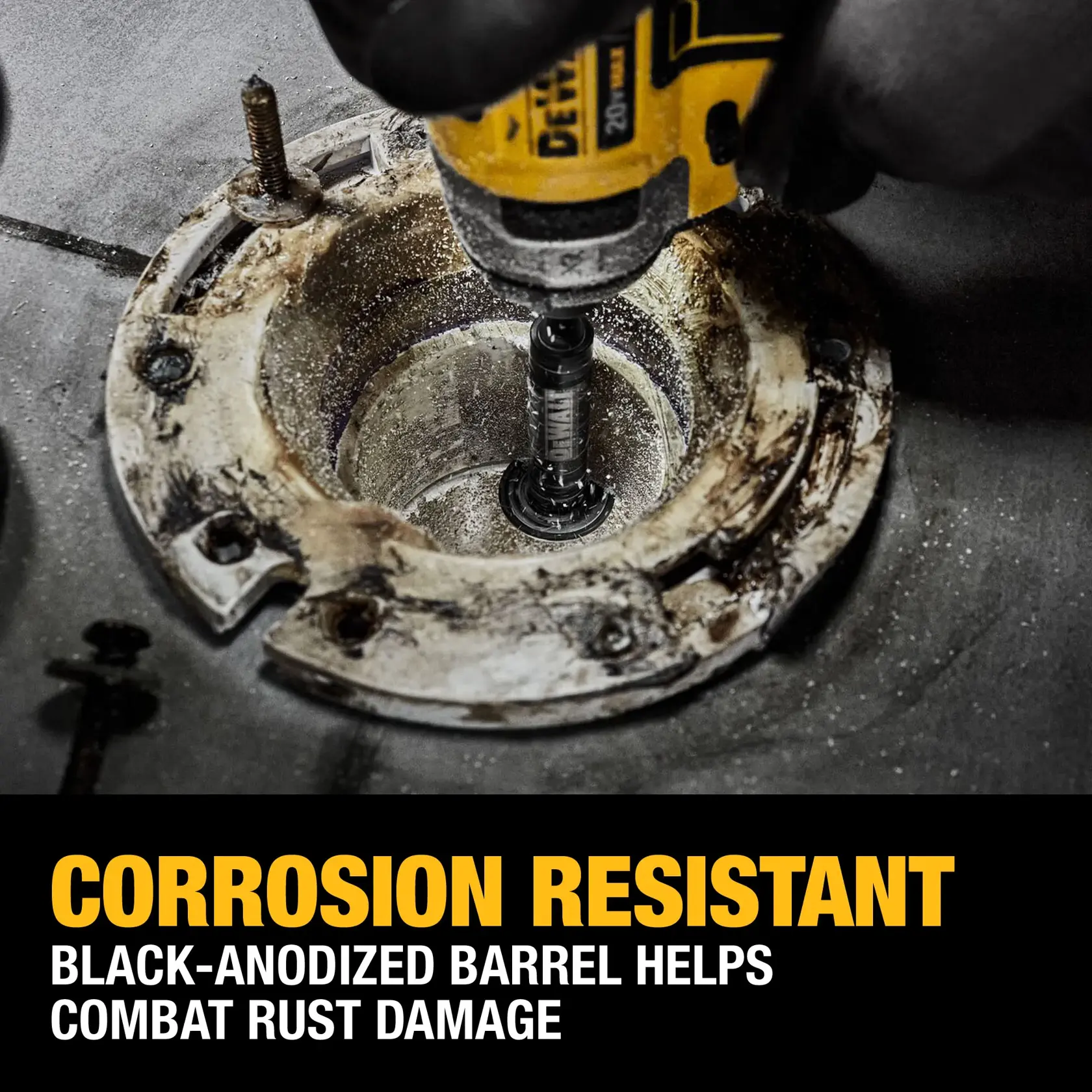 A close-up of a DEWALT power tool being used with a black-anodized barrel inside a corroded metal fixture, highlighting corrosion resistance and rust protection features.