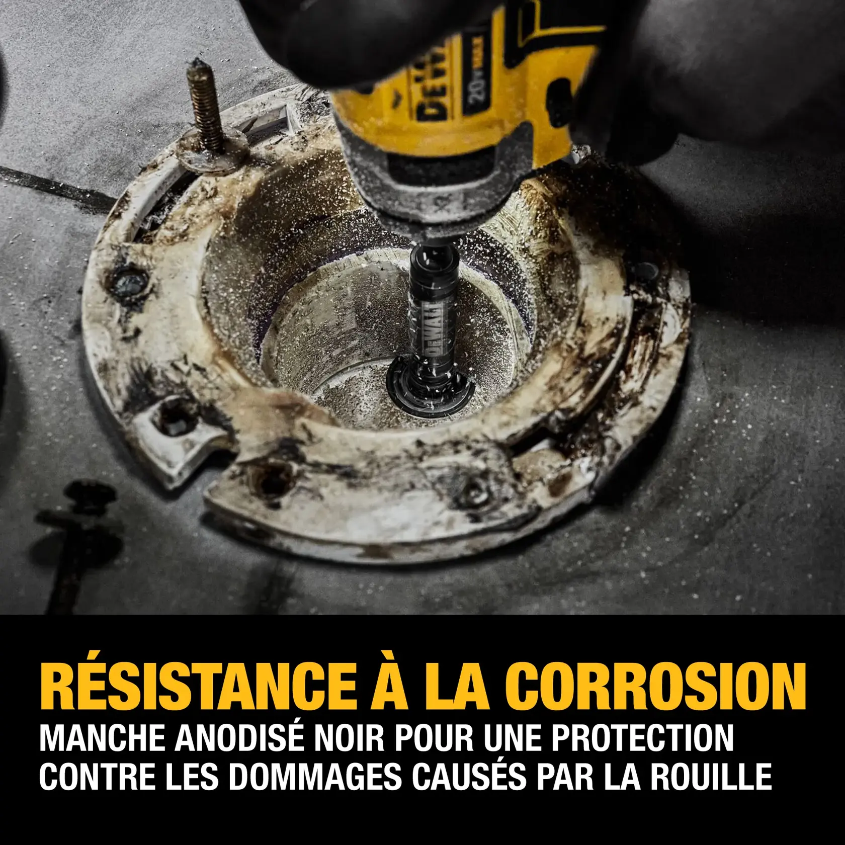 A close-up of a DEWALT power tool being used with a black-anodized barrel inside a corroded metal fixture, highlighting corrosion resistance and rust protection features.