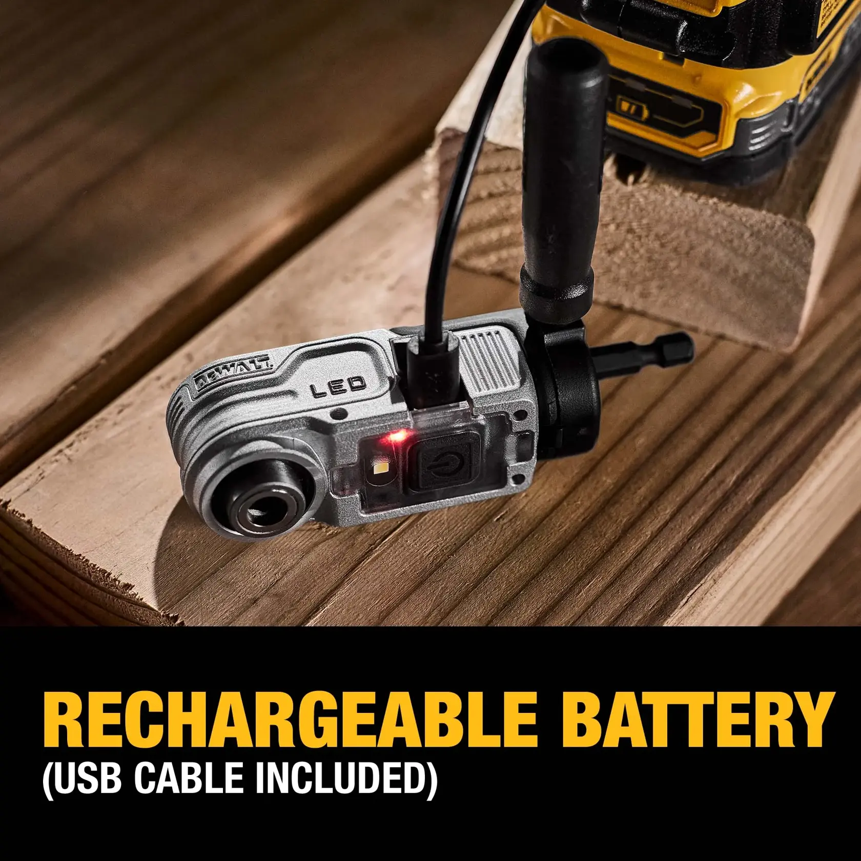 A DEWALT tool attachment with LED light is shown on a wooden surface while being plugged in via a USB cable for charging. The text at the bottom reads: 'Rechargeable battery (USB cable included)'.