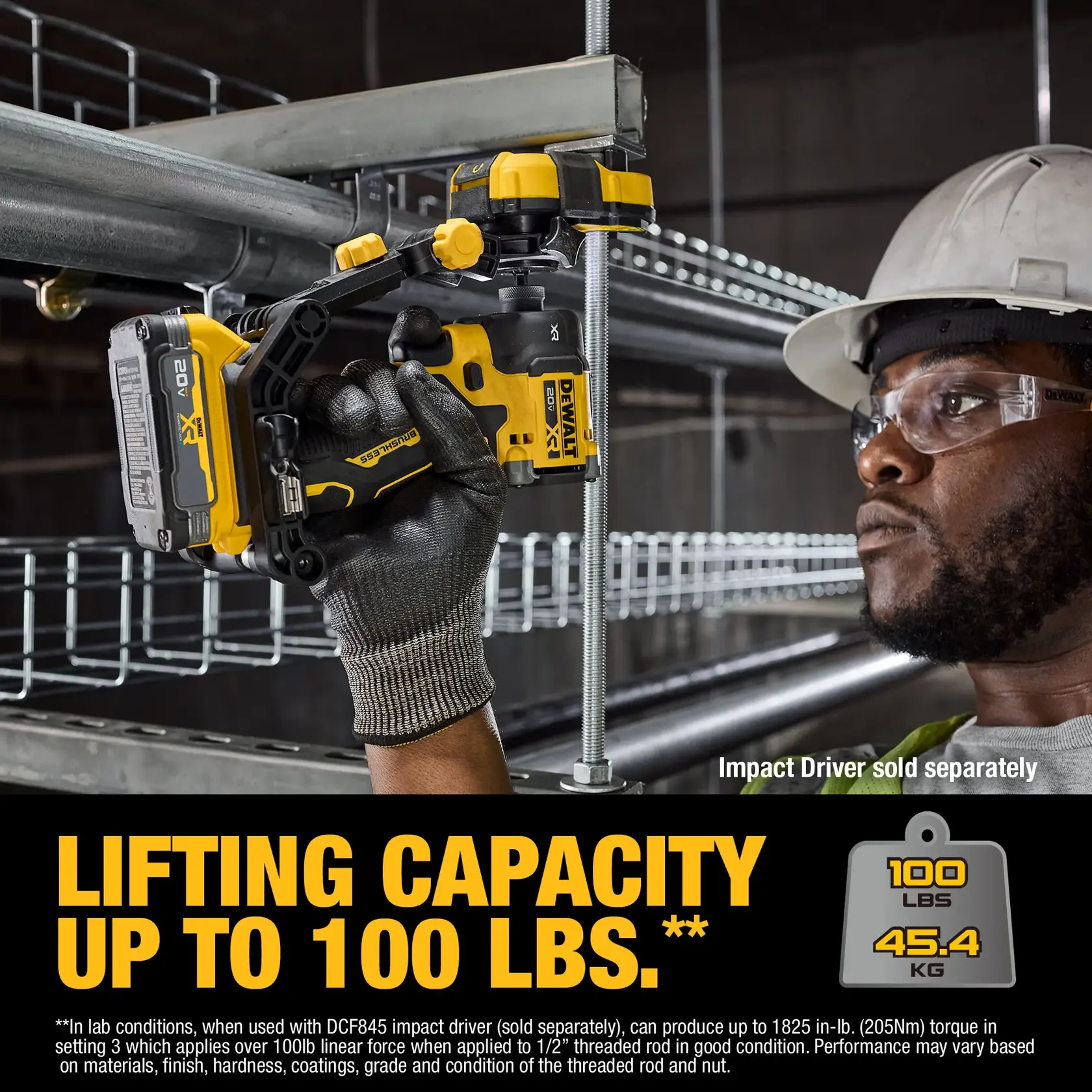 A DEWALT lifting tool is shown being used to lift metal pipes with a threaded rod, demonstrating a lifting capacity of up to 100 lbs (45.4 kg). The worker's face is blurred, and the product is highlighted with clear text stating the lifting capacity. The image notes that the impact driver is sold separately.