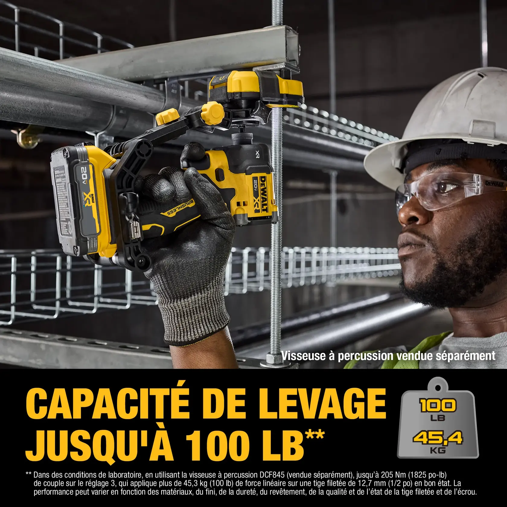 A DEWALT lifting tool is shown being used to lift metal pipes with a threaded rod, demonstrating a lifting capacity of up to 100 lbs (45.4 kg). The worker's face is blurred, and the product is highlighted with clear text stating the lifting capacity. The image notes that the impact driver is sold separately.
