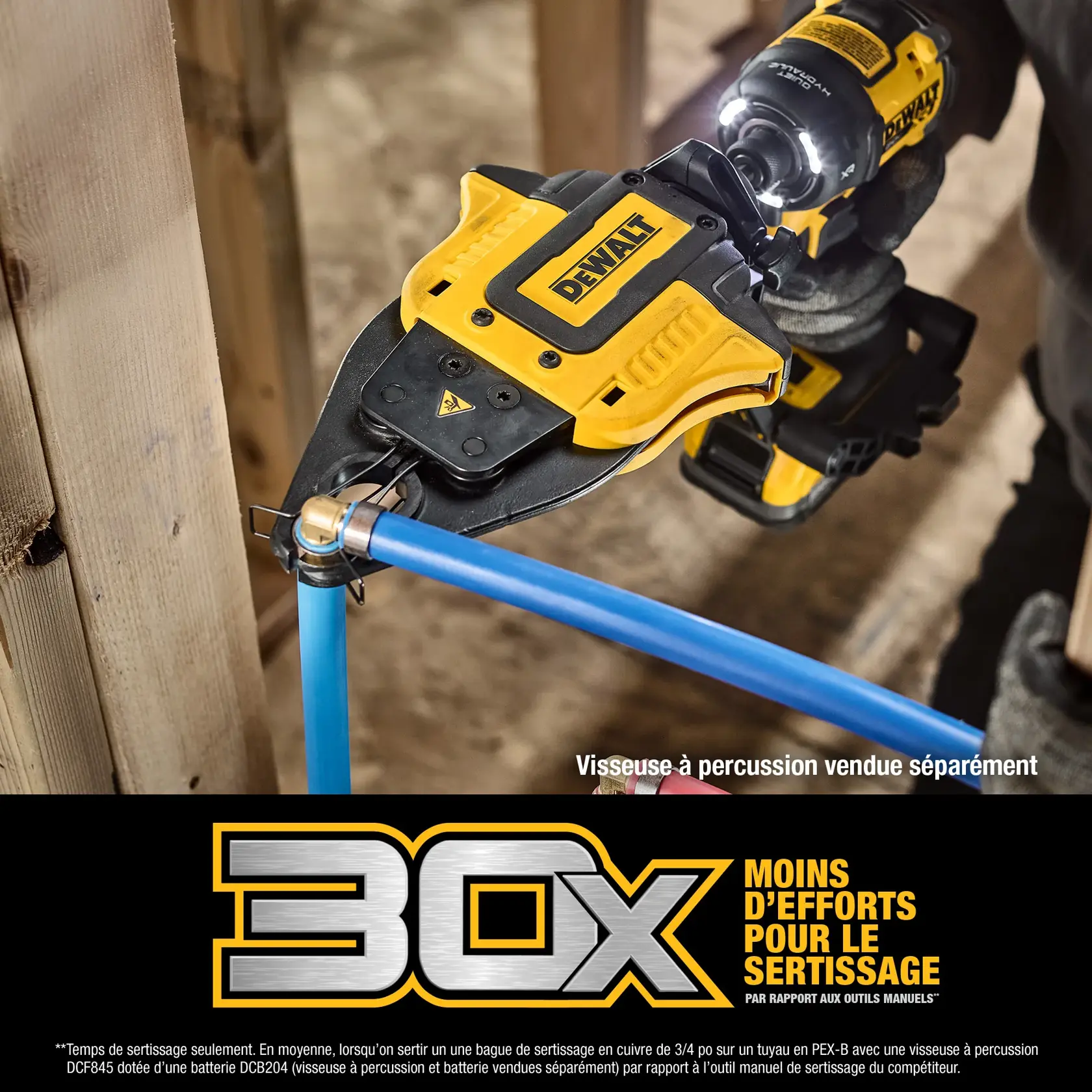A DEWALT power tool is being used to press a pipe fitting onto a plumbing pipe, held by a gloved hand in a construction setting with wooden framing.