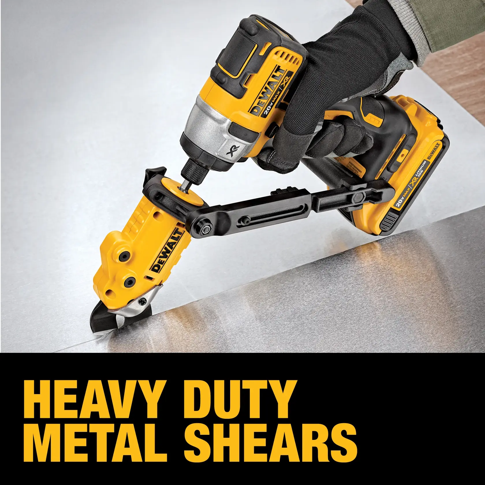 A person wearing a glove is using a DEWALT heavy duty metal shear attachment connected to a power tool to cut a sheet of metal. The image also features the text 'HEAVY DUTY METAL SHEARS' in bold yellow letters.
